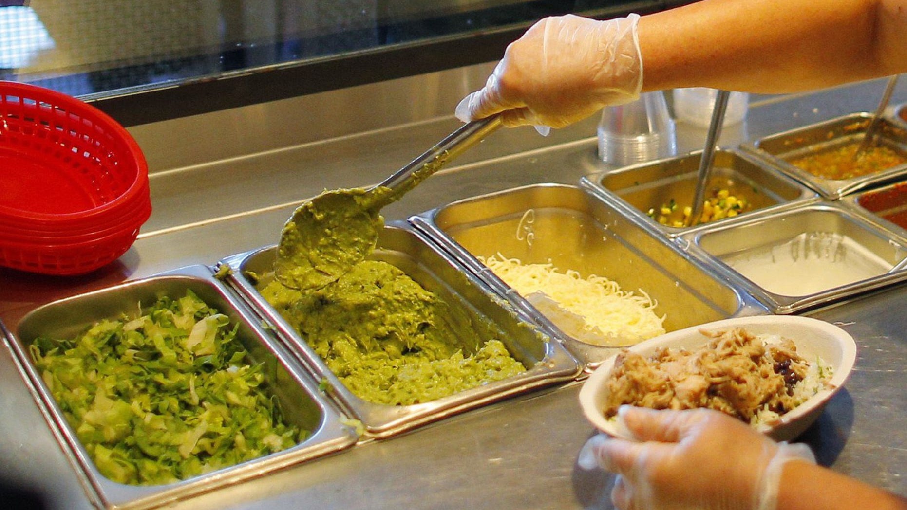 A carnitas burrito bowl gets the works at Chipotle.