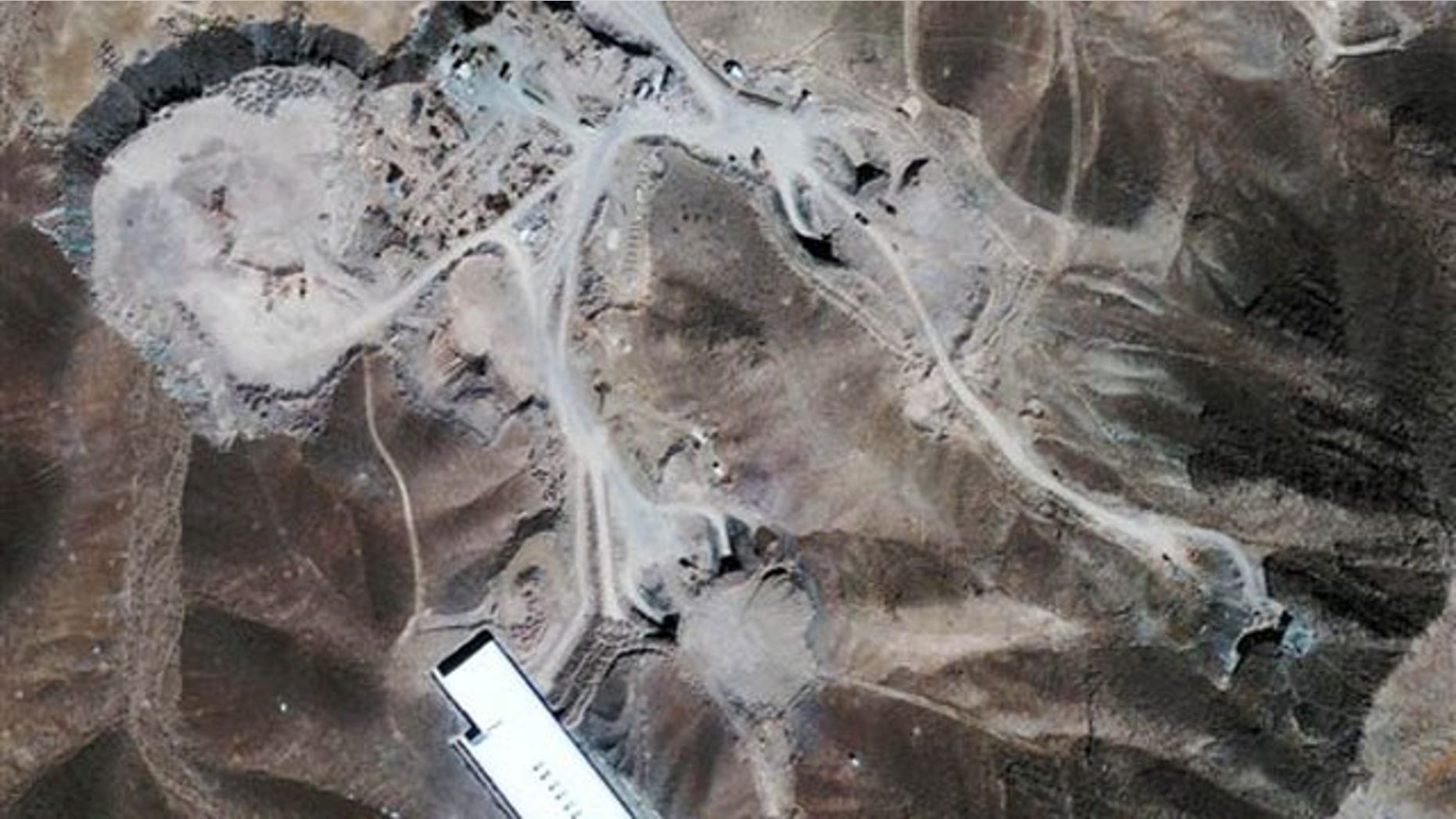 Sept. 26, 2009: This satellite image provided by GeoEye shows a facility inside a mountain outside of Qom, Iran.