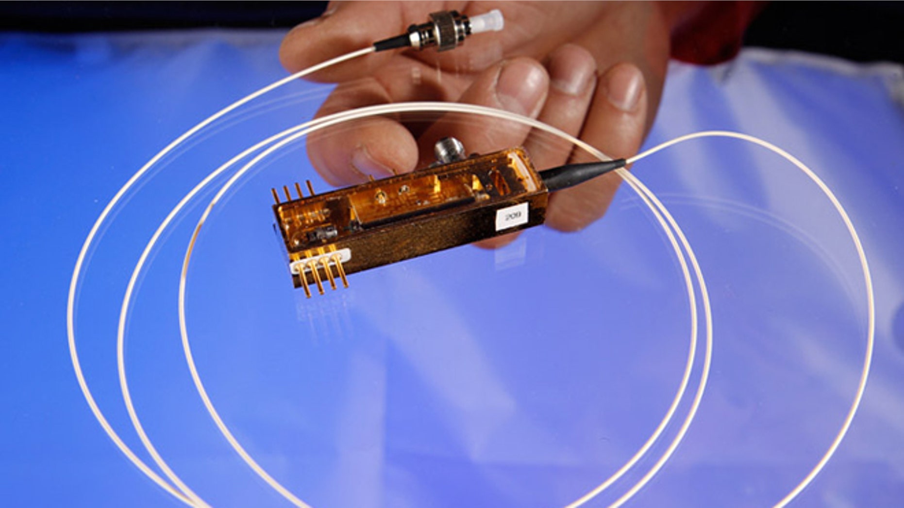 Feb. 14, 2013: Los Alamos National Laboratory completed the first-ever demonstration of securing control data for electric grids using quantum cryptography, with this miniature transmitter.