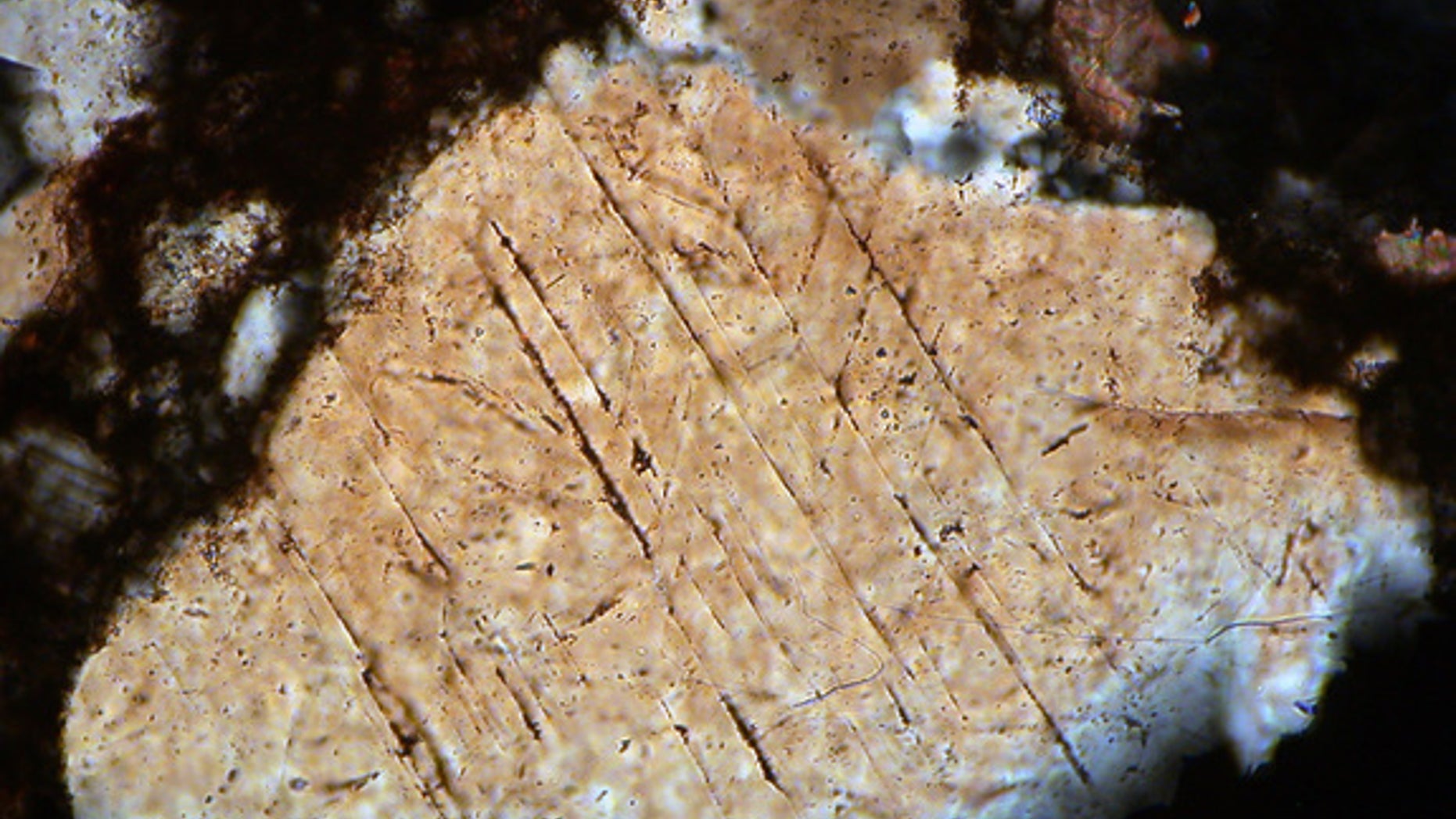 A photo taken through a microscope of shocked minerals from the Hummeln crater in Sweden.