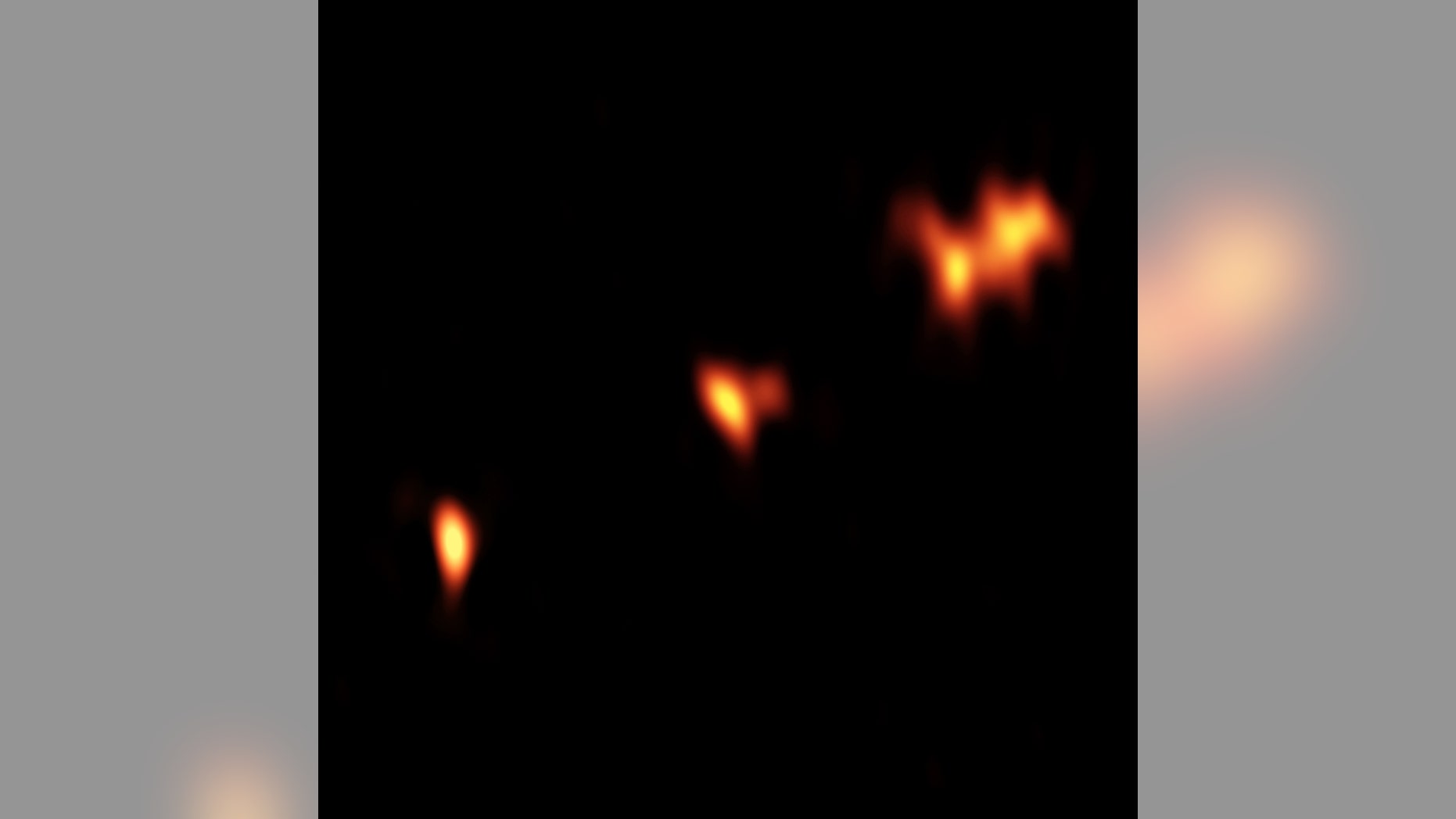 VLBA image of the quasar P352-15 at a distance of nearly 13 billion light-years from Earth. Three main components of the object are seen, with two of them showing further substructure.