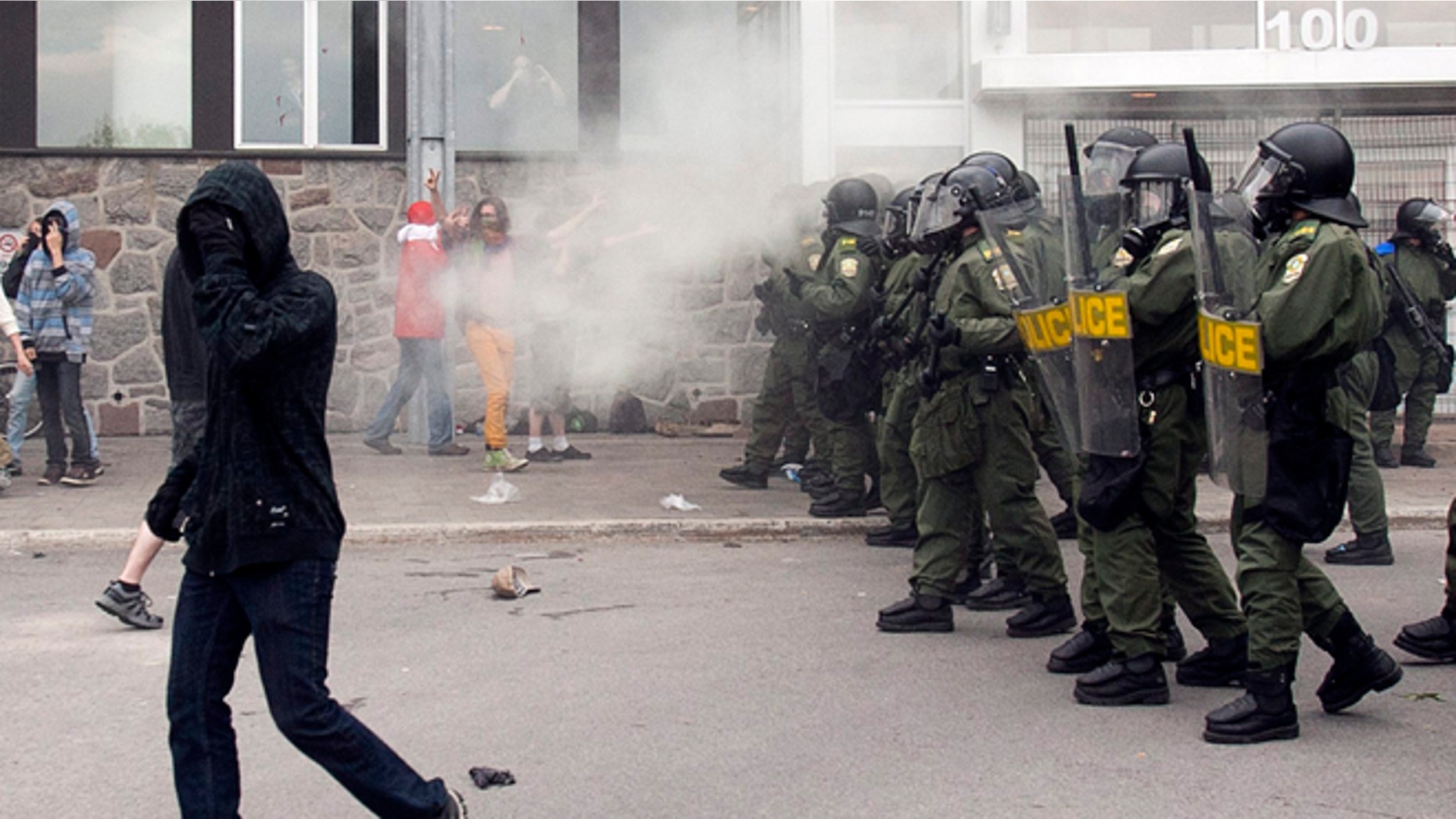 May 15, 2012: Quebec Provincial Police use tear gas to disperse students protesting against tuition hikes at the Lionel Groulx college in Ste. Therese, Quebec, Canada.
