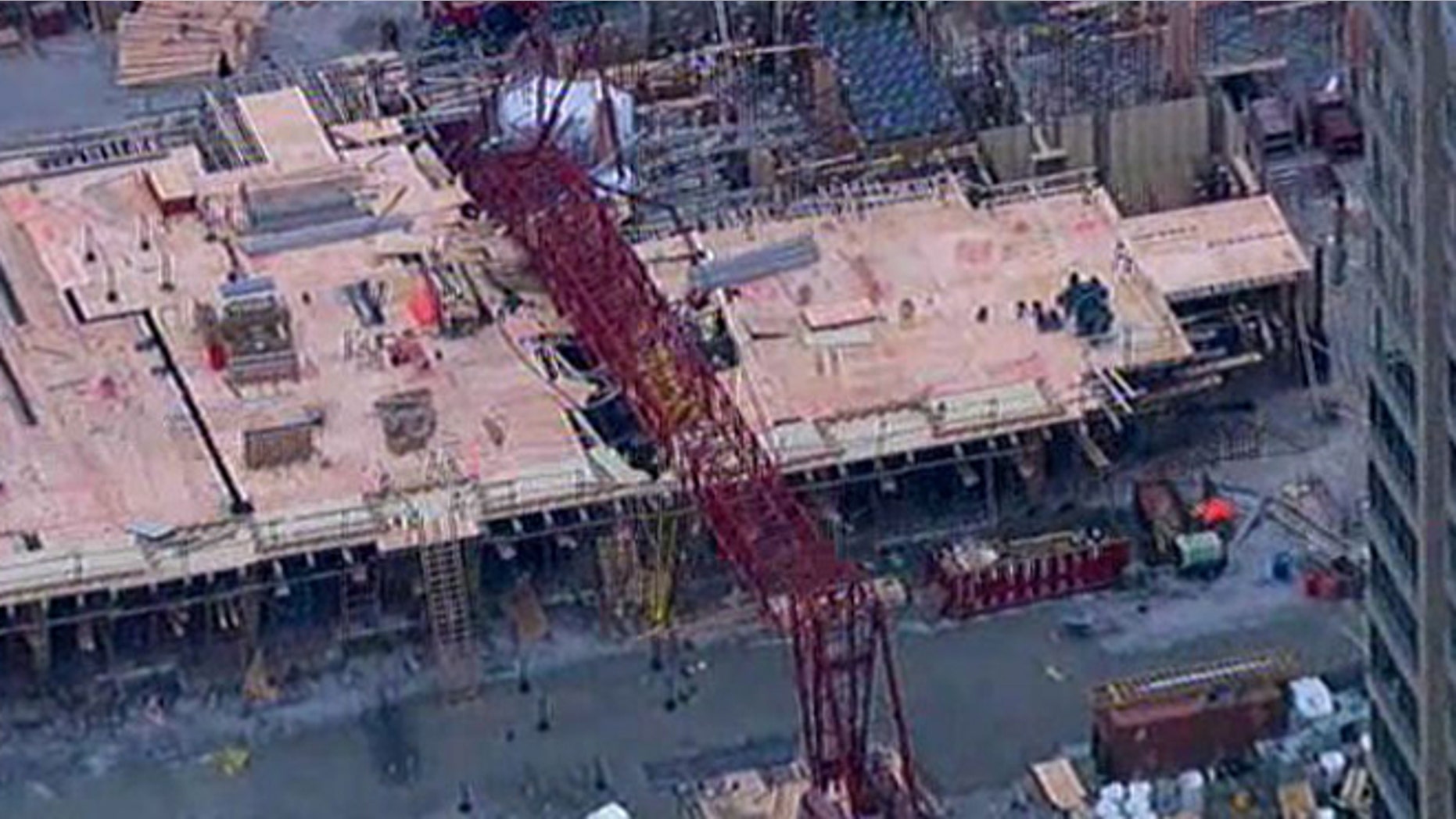 At least 4 people were injured after a large crane collapsed in Queens, N.Y.
