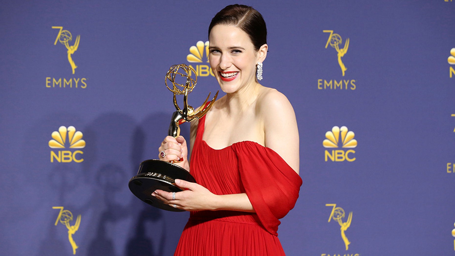 Rachel Brosnahan poses in the press room with the award for outstanding lead actress in a comedy series for "The Marvelous Mrs. Maisel."