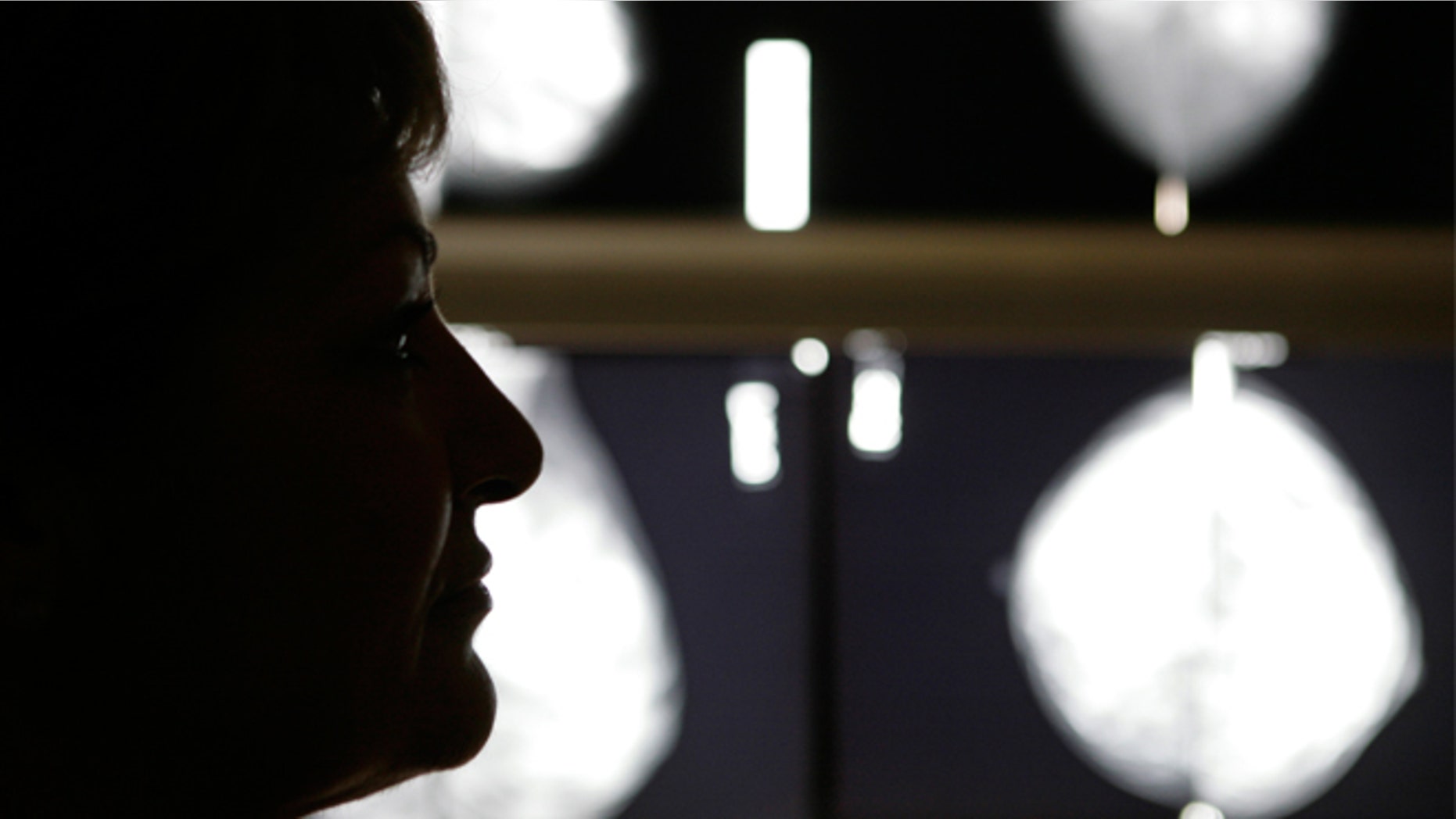 Vasiliki Kostoula, a breast cancer patient, listens to her doctor after a radiological medical examination. (REUTERS/Yannis Behrakis)