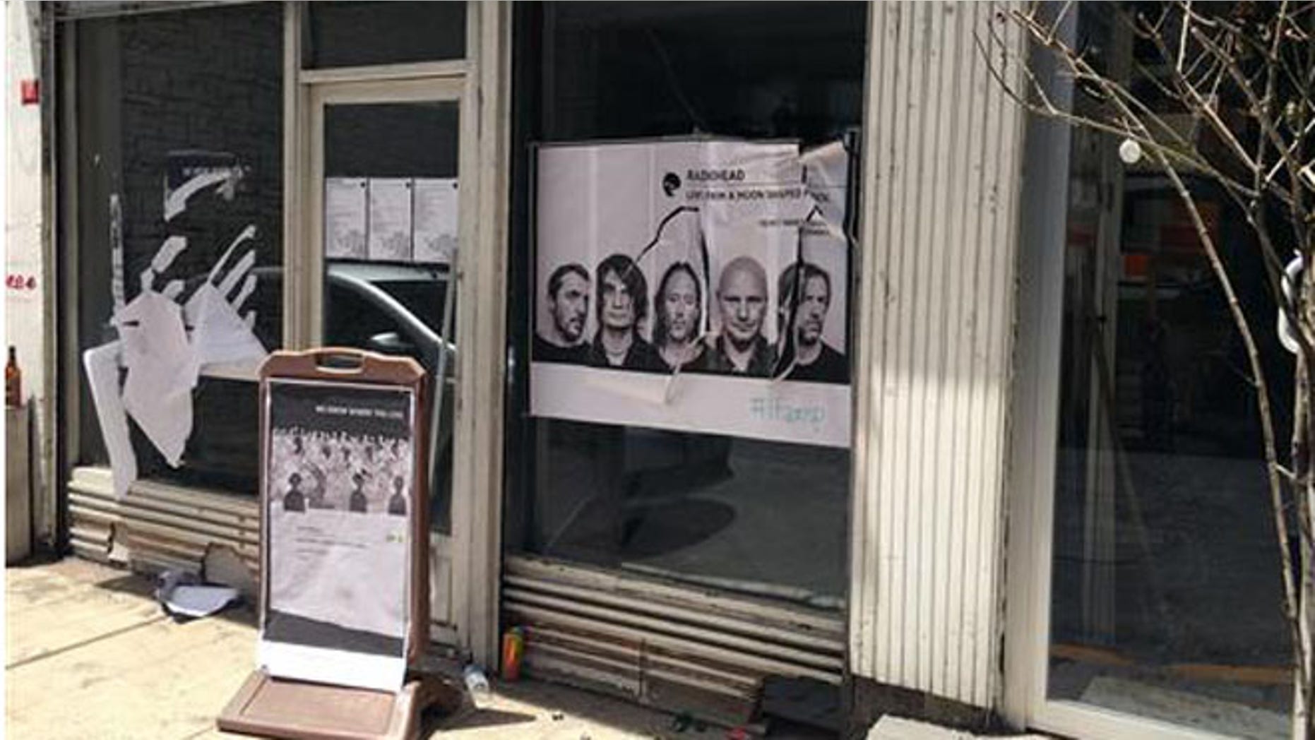 A ripped up poster advertising the streaming event of Radiohead's new album, at a record shop, in Istanbul, Saturday, June 18, 2016. (AP Photo/Dominique Soguel)