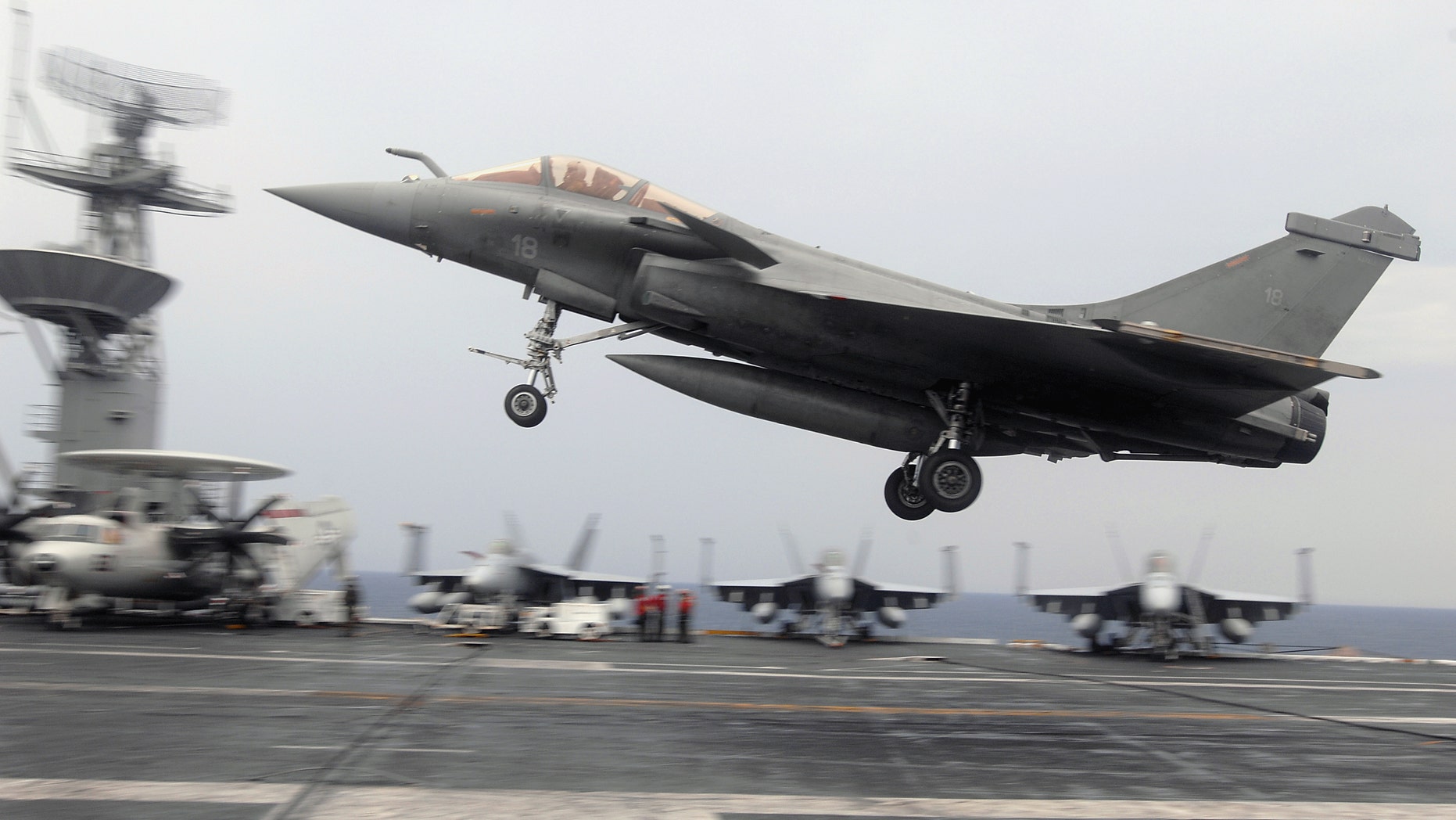 File photo - A French F-2 Rafale fighter performs a touch-and-go during combined French and American carrier qualifications aboard the aircraft carrier USS Theodore Roosevelt (CVN 71). The Theodore Roosevelt Carrier Strike Group is participating in Joint Task Force Exercise "Operation Brimstone" off the Atlantic coast. (U.S. Navy photo by Mass Communication Specialist 3rd Class Sheldon Rowley/Released)
