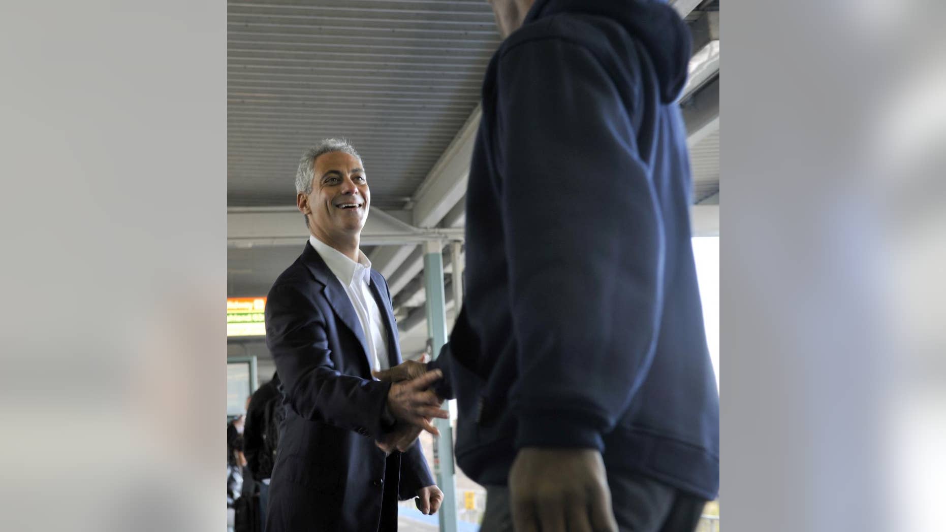 Former White House chief of staff Rahm Emanuel greets commuters at a downtown train station as he campaigns for Chicago mayor on Monday, Oct. 4, 2010 in Chicago. (AP Photo/Chicago Sun-Times, Brian Jackson)