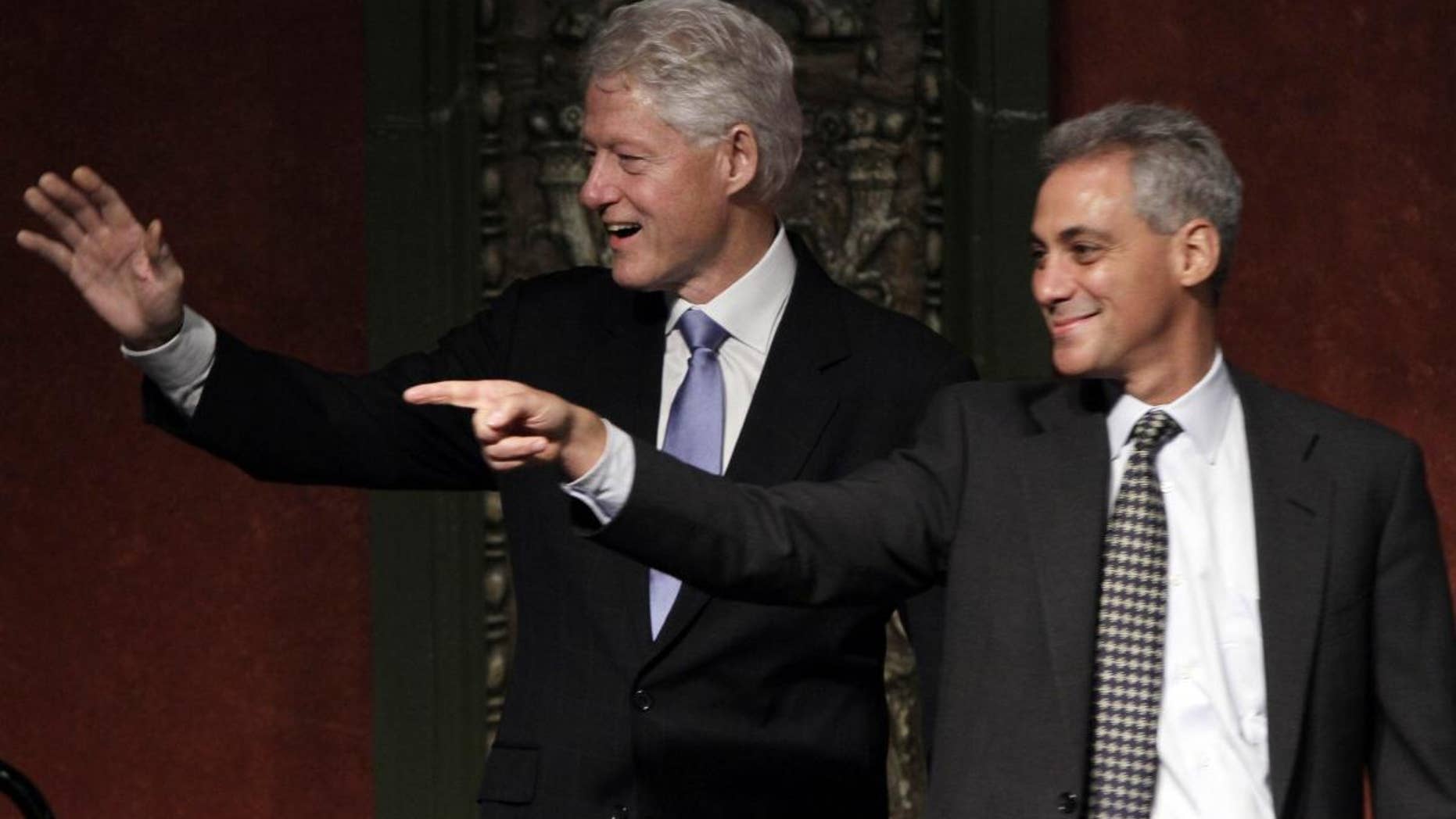 Former President Bill Clinton, left, appears at a rally for Chicago mayoral candidate and former White House chief of staff Rahm Emanuel, Tuesday, Jan. 18, 2011, in Chicago. Emanuel is vying to succeed the retiring Mayor Richard Daley. The election is Feb. 22. (AP Photo/M. Spencer Green)
