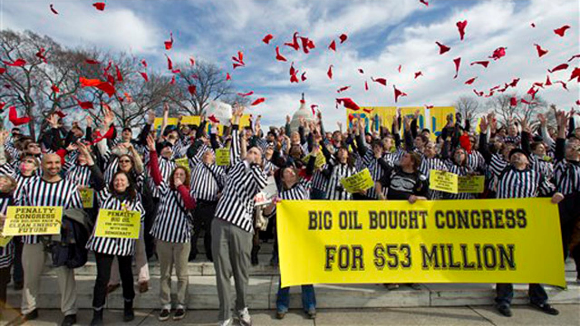 Jan. 24, 2012: Protesters against the Keystone XL pipeline dressed as referees throw red penalty flags during a rally on Capitol Hill.