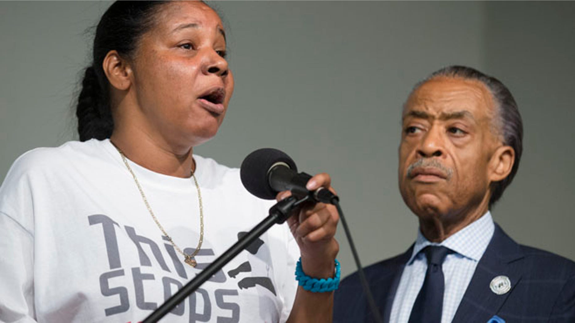 July 26, 2014: Esaw Garner, wife of Eric Garner, left, speaks alongside the Rev. Al Sharpton during a rally at the National Action Network headquarters in New York.