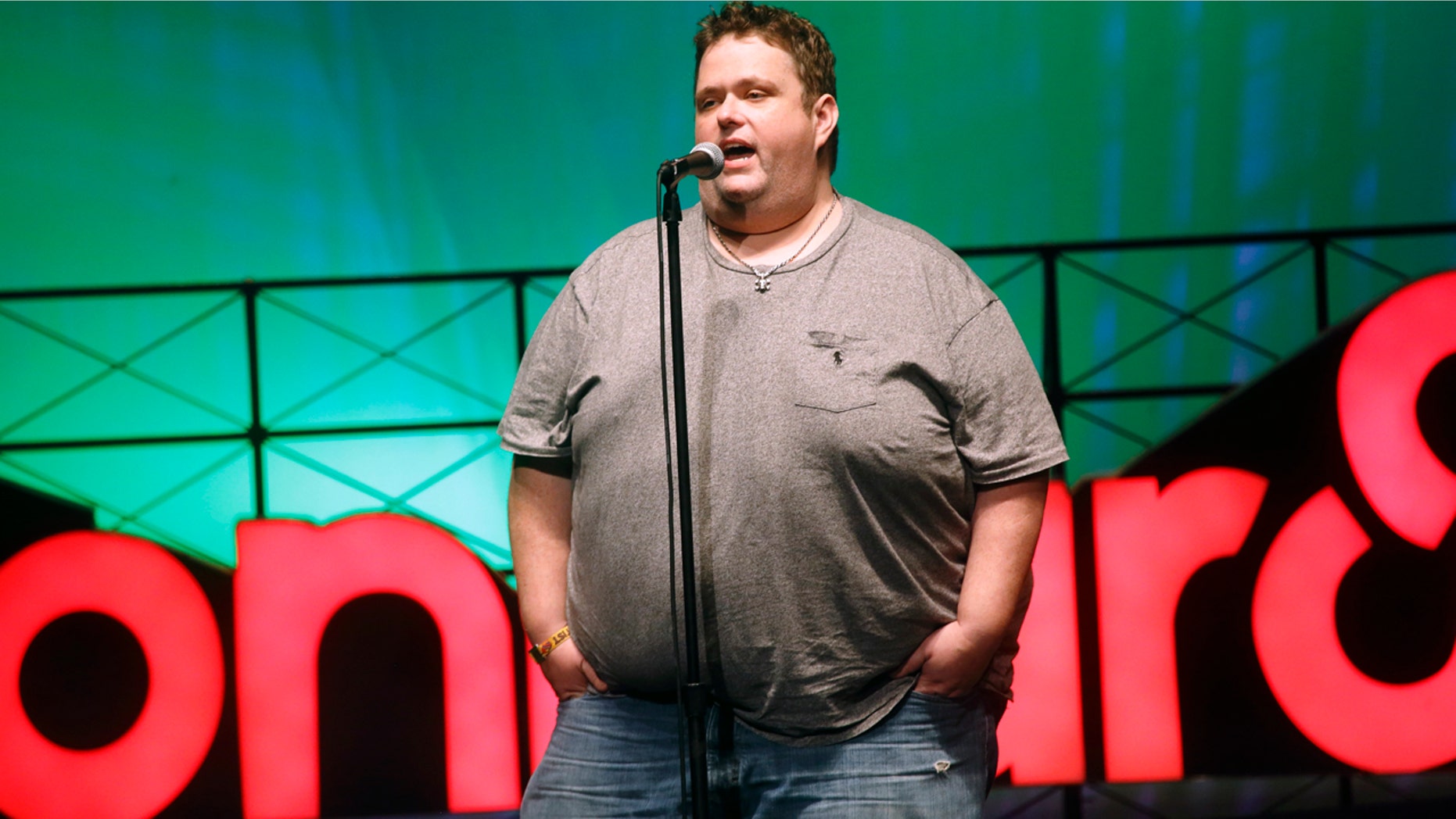 FILE - In this June 13, 2015 file photo, Ralphie May performs at the 2015 Bonnaroo Music and Arts Festival in Manchester, Tenn. A spokeswoman for Ralphie May says the comedian has died at age 45. In a statement Friday, Oct. 6, 2017, publicist Stacey Pokluda said May died of cardiac arrest. She said he had been fighting pneumonia, which caused him to cancel a few appearances in the past month. (Photo by John Davisson/Invision/AP, File)