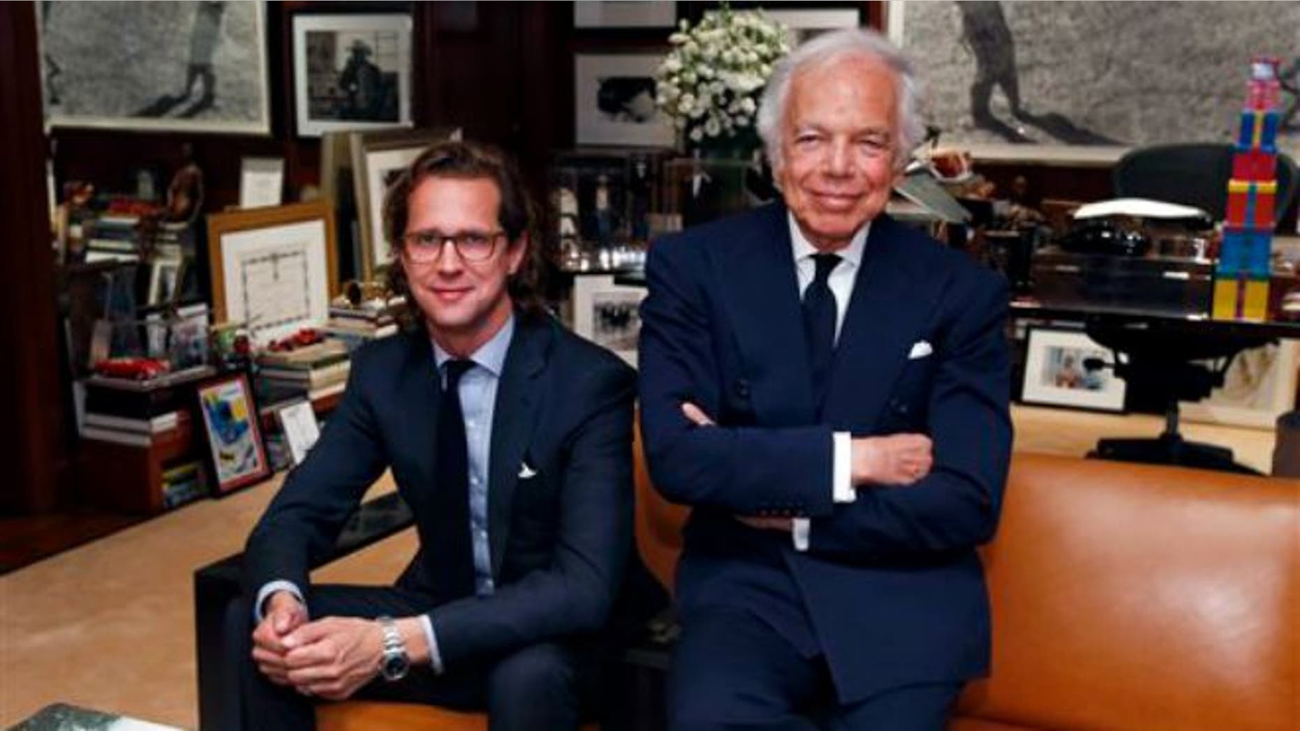 Sept. 29, 2015: Designer Ralph Lauren, right, poses in his office with Stefan Larsson, global brand president for Old Navy, in New York. Lauren is stepping down as CEO of the fashion and home decor empire that he founded nearly 50 years ago, and Larsson, who has been the global president of Old Navy for three years, will succeed him.