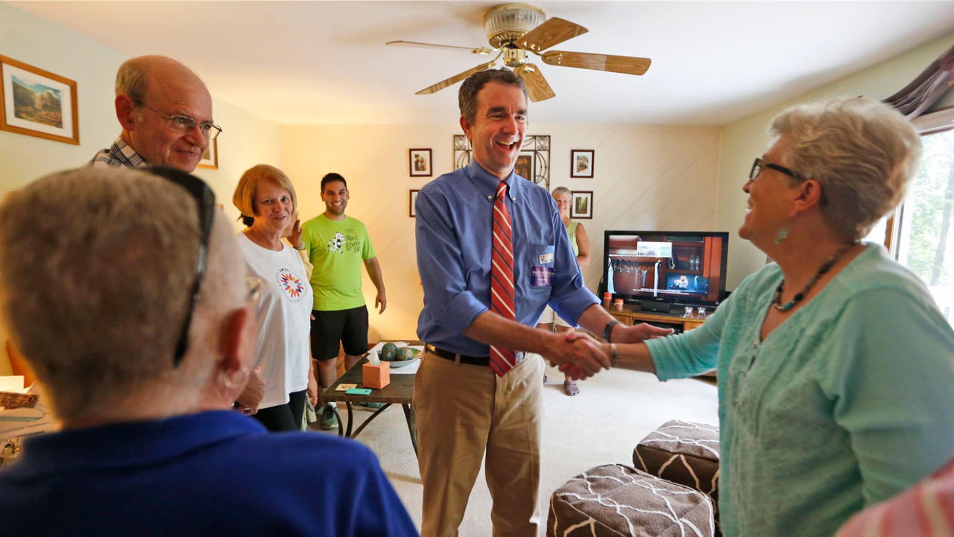 Democratic candidate for governor, Lt. Gov. Ralph Northam greets voters at a canvas kickoff Tuesday, June 13, 2017, in Chesterfield, Va. Lt. Gov Ralph Northam faces former Congressman Tom Perriello in today's primary. (AP Photo/Steve Helber)