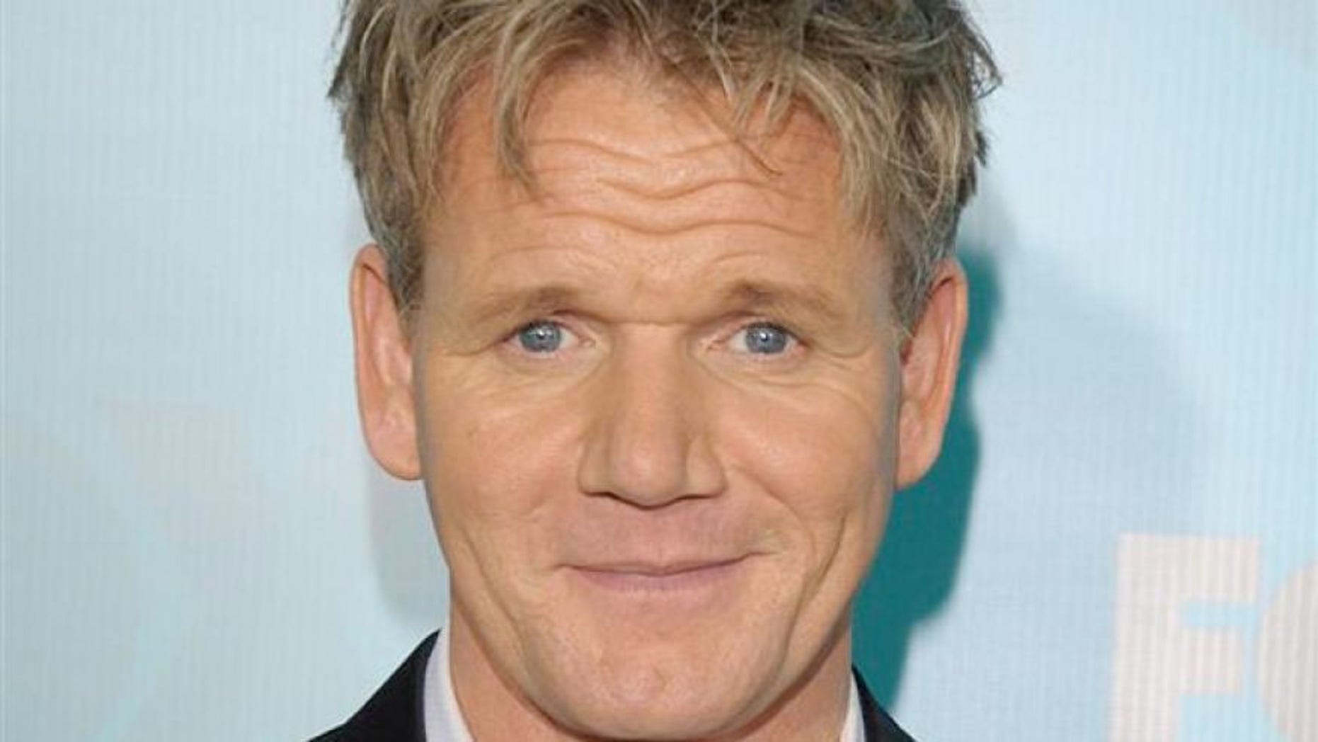 The celebrity chef says that a rival block booked fake reservations opening night.
