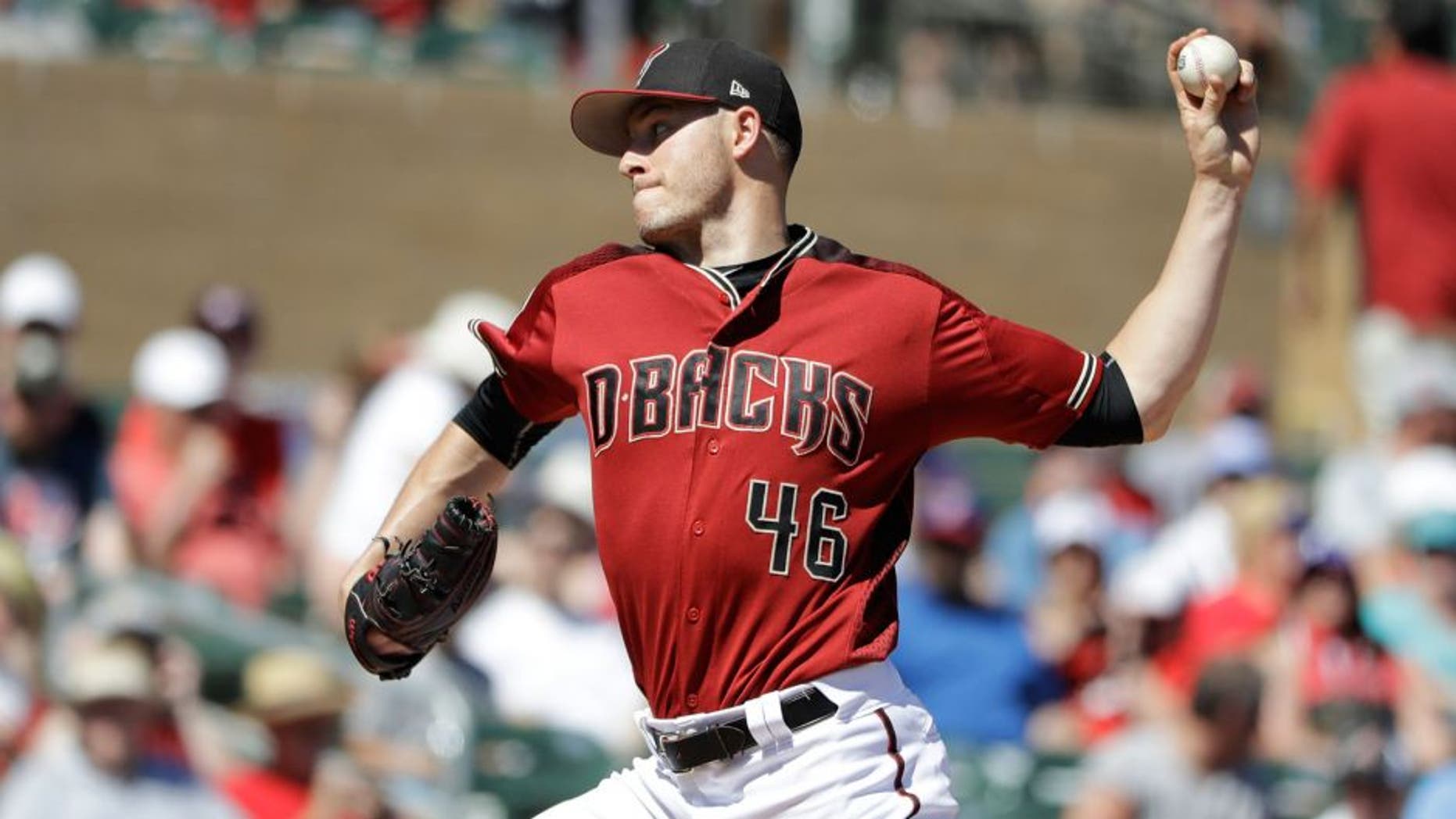 Arizona Diamondbacks' Patrick Corbin throws during the first inning of a spring training baseball game against the Texas Rangers, Tuesday, March 14, 2017, in Scottsdale, Ariz. (AP Photo/Darron Cummings)