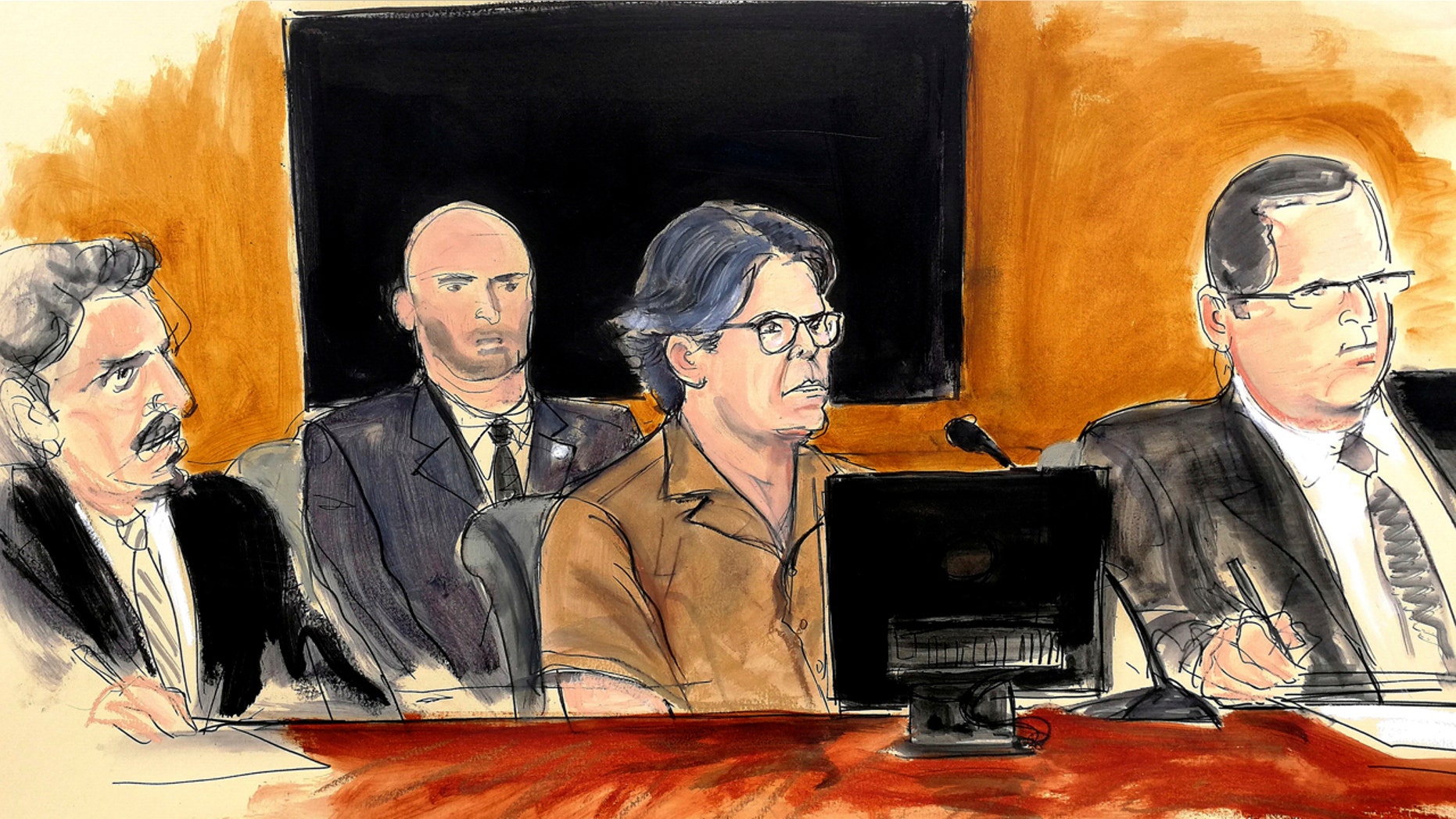 In this courtroom sketch Keith Raniere, second from right, leader of the secretive group NXIVM, attends a court hearing Friday in the Brooklyn borough of New York.