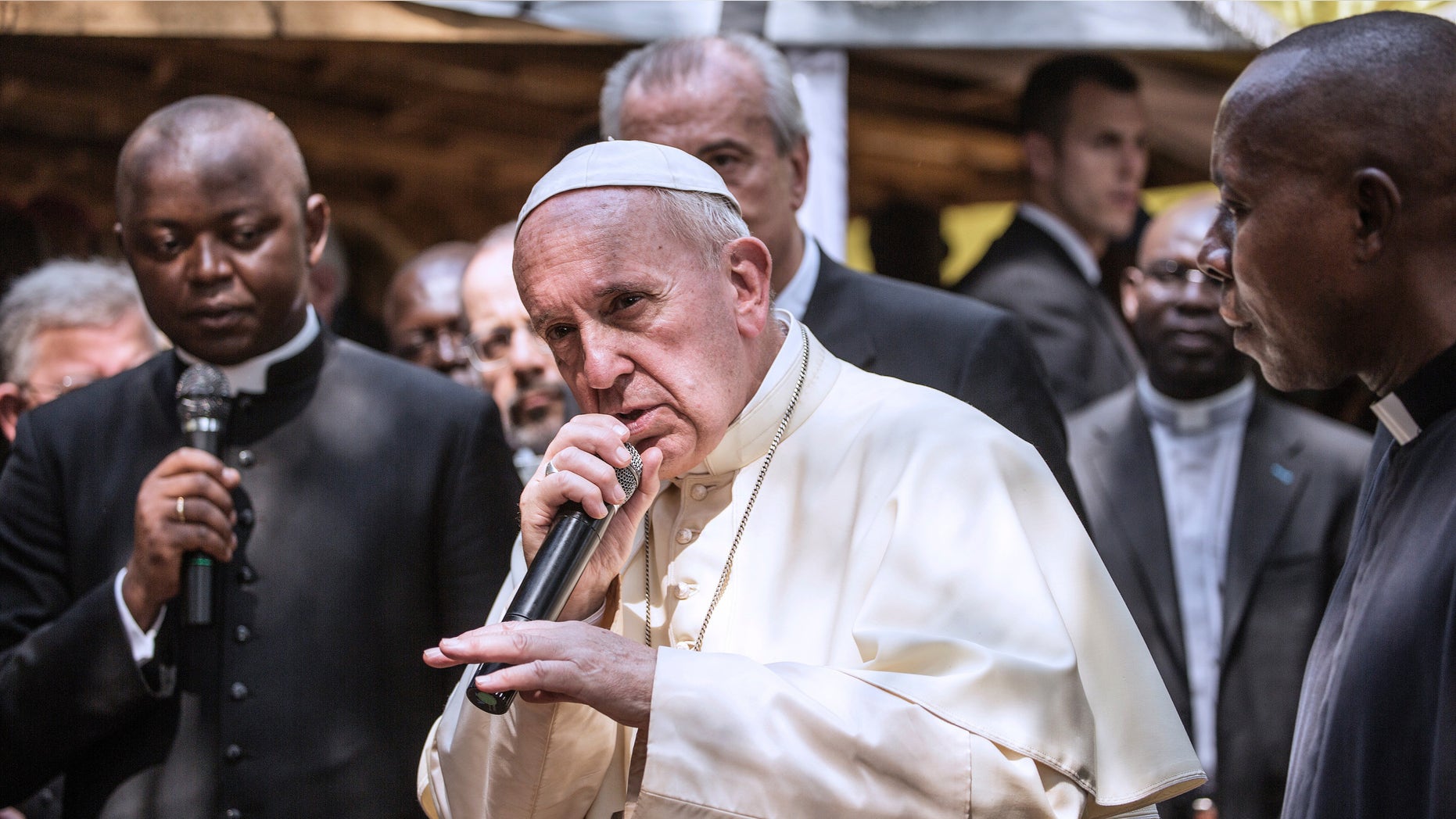 Pope Francis gestures as he gives his blessing in Bangui on November 29, 2015.