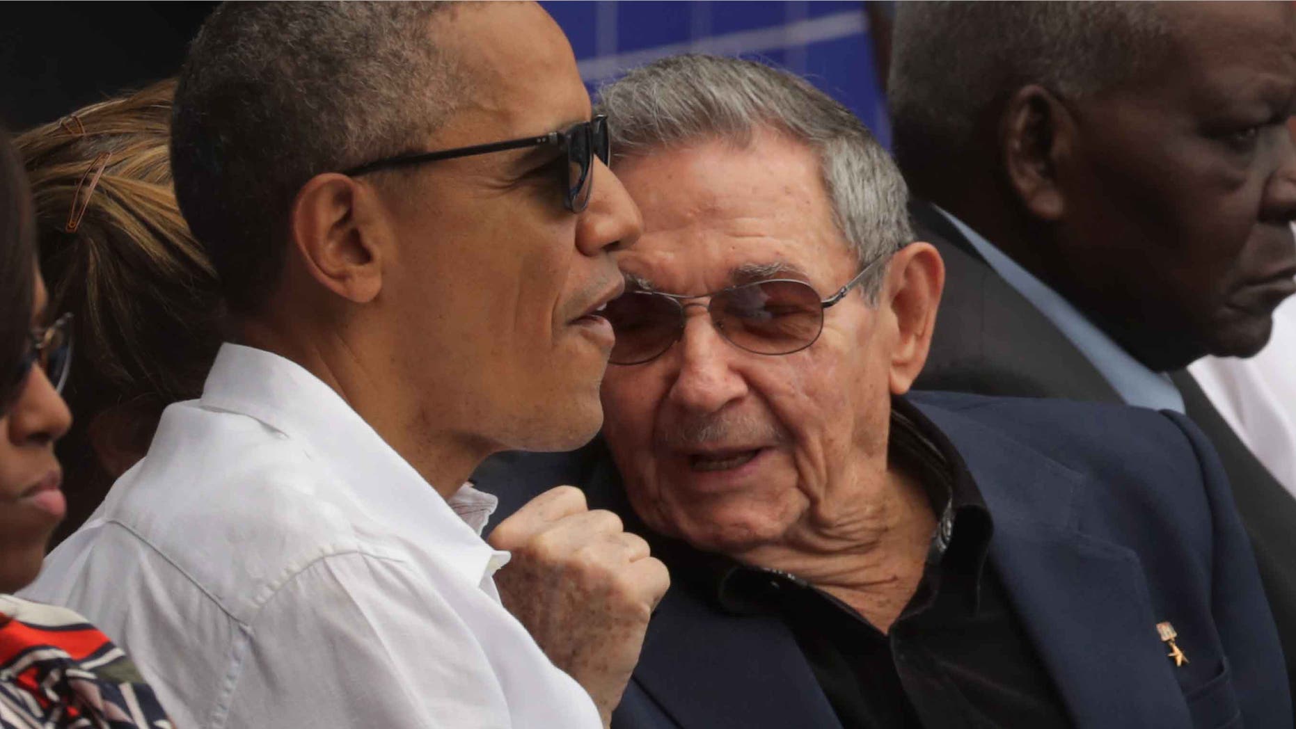 HAVANA, CUBA - MARCH 22: U.S. President Barack Obama (L) and Cuban President Raul Castro talk during an exposition game between the Cuban national baseball team and Major League Baseball's Tampa Bay Devil Rays at the Estado Latinoamericano March 22, 2016 in Havana, Cuba. This is the first time a sittng president has visited Cuba in 88 years. (Photo by Chip Somodevilla/Getty Images)