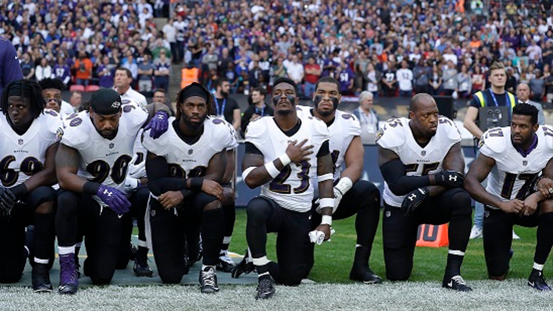 Baltimore Ravens players knelt during the playing of the U.S. national anthem on Sunday.