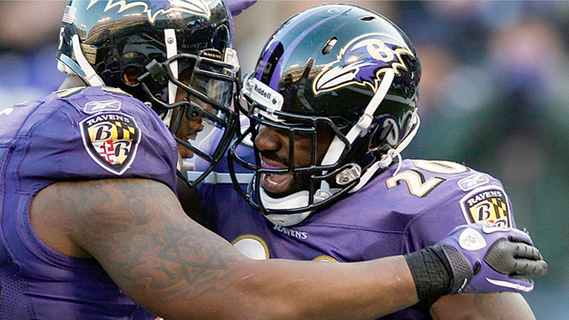 Jan. 15, 2012: Baltimore Ravens free safety Ed Reed, right, celebrates his interception with teammate outside linebacker Terrell Suggs during the second half of an NFL divisional playoff football game against the Houston Texans in Baltimore.