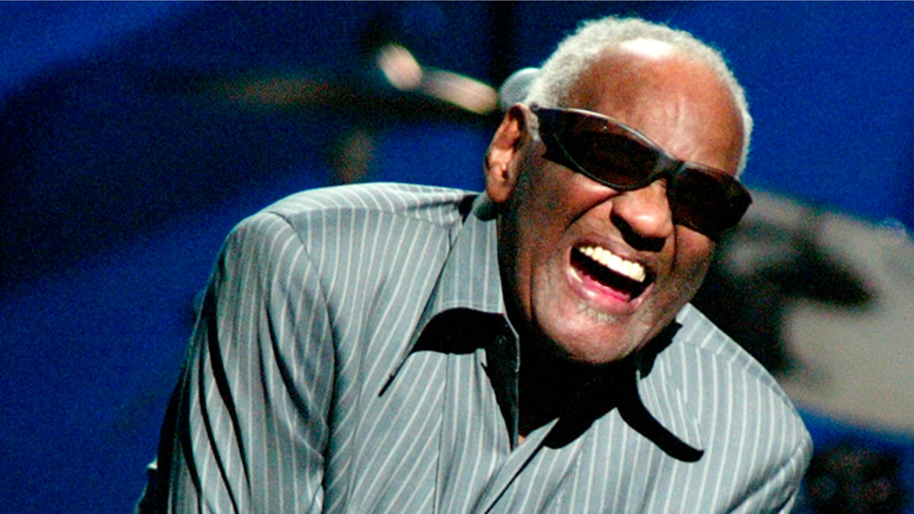 April 9, 2003. Ray Charles takes a bow after he sang with Willie Nelson at a concert in New York City.