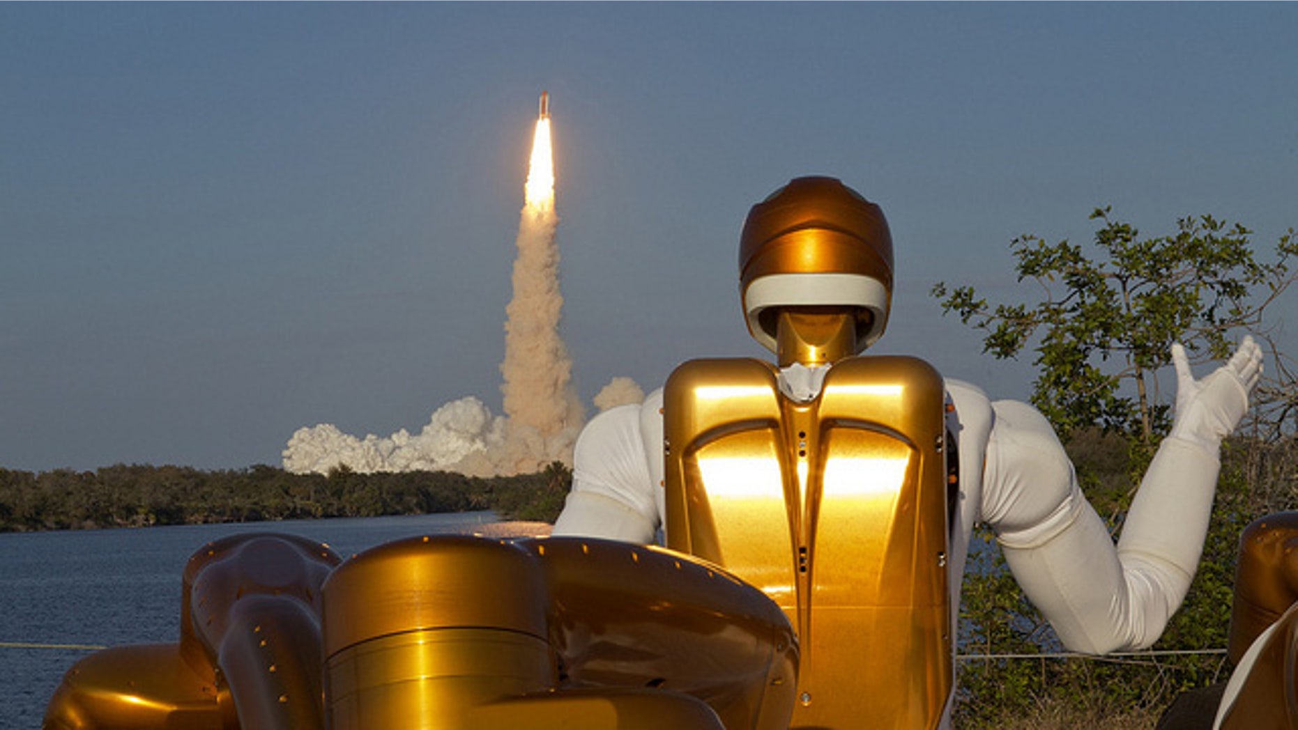 Robonaut R2A waving goodbye as Robonaut R2B launches into space aboard STS-133. R2 is the first humanoid robot in space.