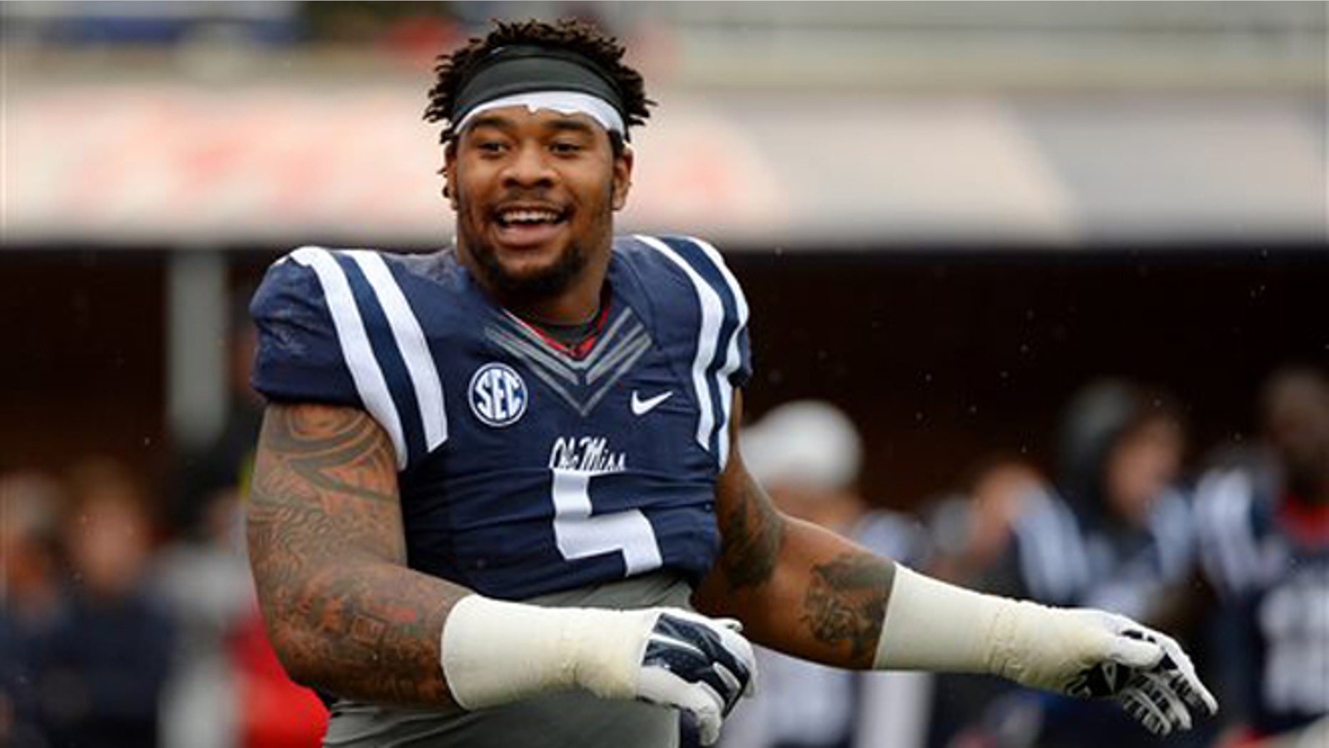 Nov. 7, 2015: Mississippi defensive tackle Robert Nkemdiche stretches before an NCAA college football game against Arkansas in Oxford, Miss. (AP Photo/Thomas Graning)