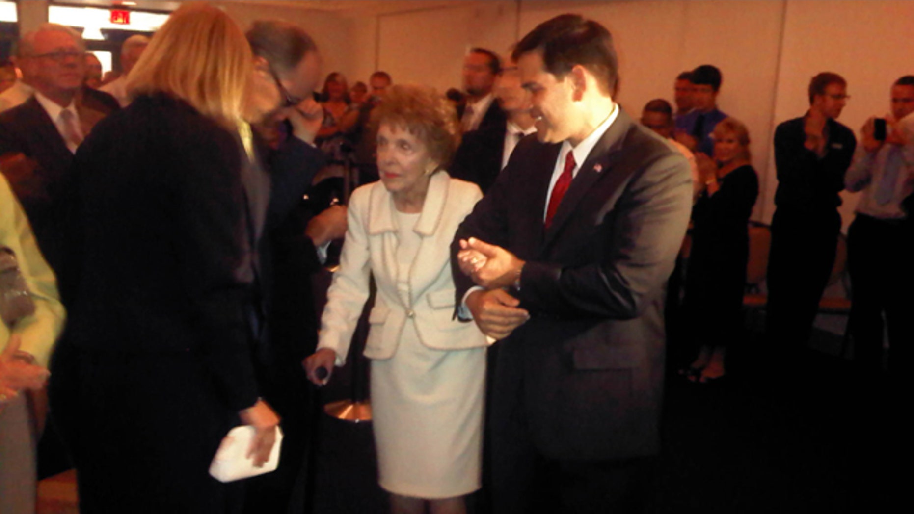Tuesday: Florida Sen. Marco Rubio escorts former first lady Nancy Reagan to her seat after helping to prevent her from stumbling as they entered the room for a speech Rubio was delivering at the Reagan Presidential Library in Simi Valley, Calif.