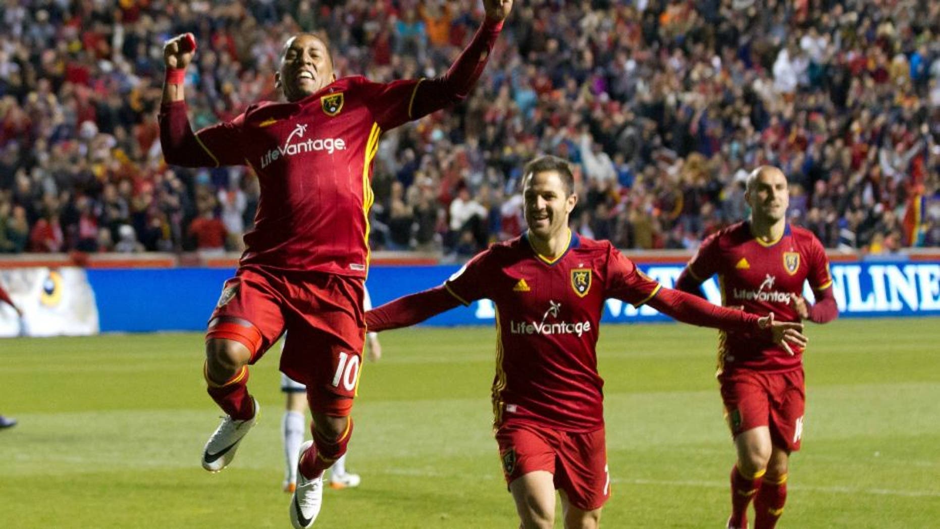 Apr 16, 2016; Sandy, UT, USA; Real Salt Lake forwards Juan Manuel Martinez (right) and Joao Plata (10) celebrate a goal during the second half against the Vancouver Whitecaps at Rio Tinto Stadium. Real Salt Lake won 1-0. Mandatory Credit: Russ Isabella-USA TODAY Sports