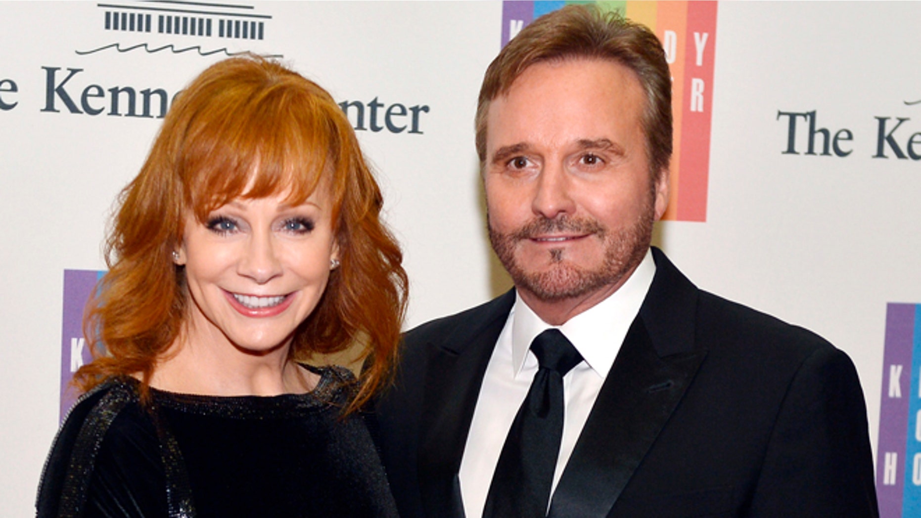 December 6, 2014. Country singer Reba McEntire and her husband Narvel Blackstock pose on the red carpet as they arrive ahead of the 37th Annual Kennedy Center gala dinner at the U.S. State Department, in Washington.