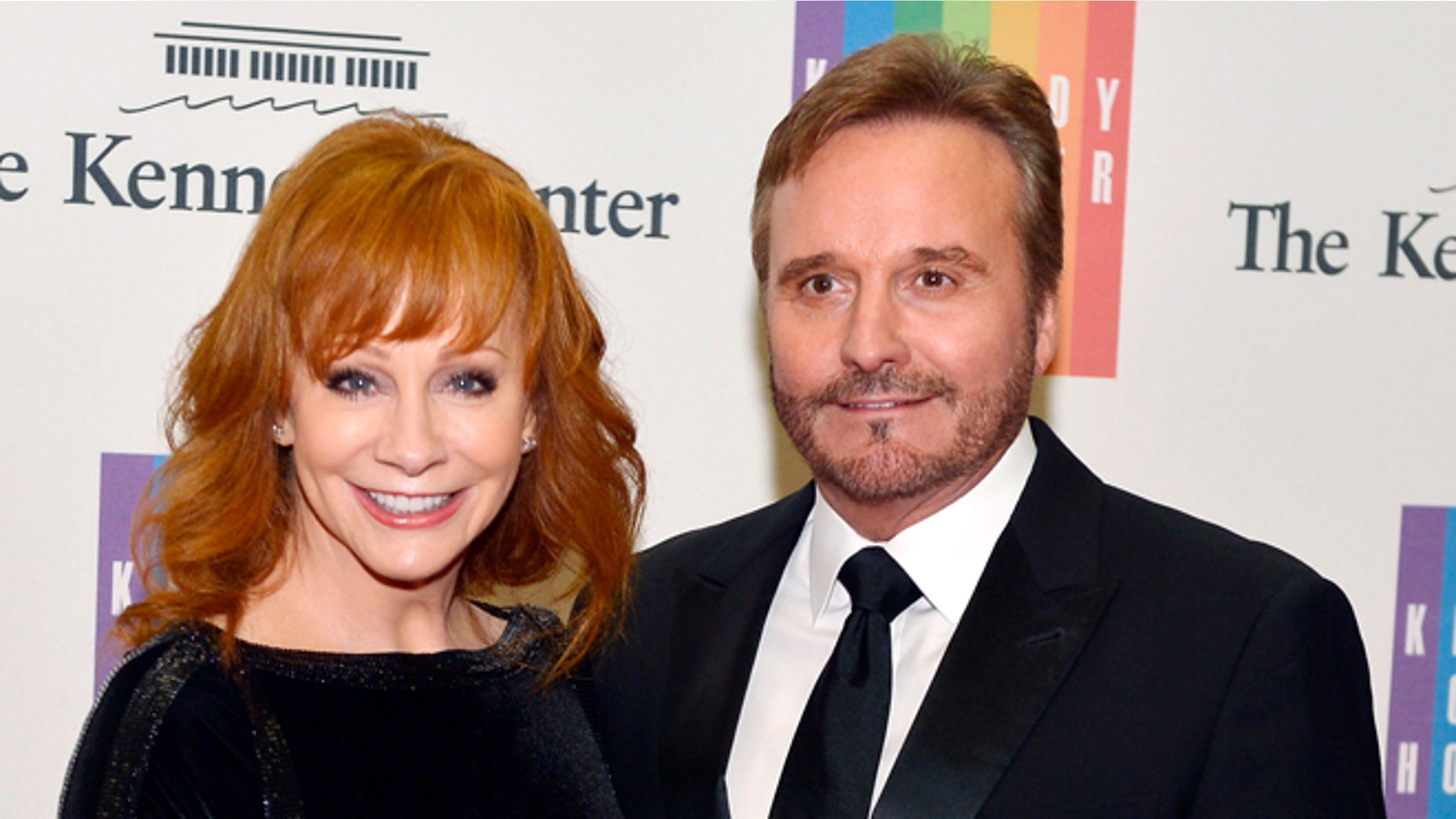 December 6, 2014. Country singer Reba McEntire and her husband Narvel Blackstock pose on the red carpet as they arrive ahead of the 37th Annual Kennedy Center gala dinner.