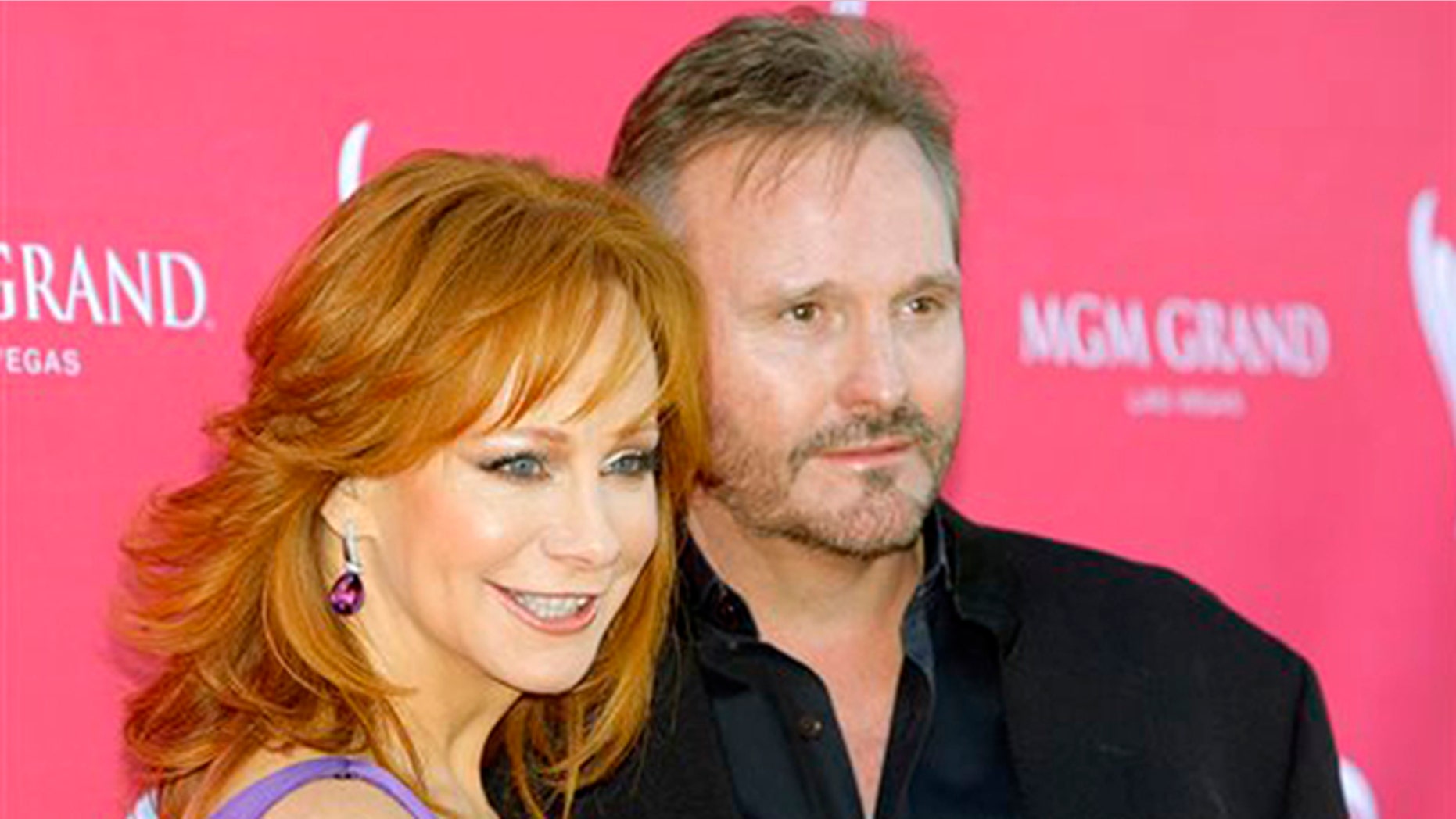 FILE - In this April 5, 2009 file photo, Reba McEntire, left, and Narvel Blackstock arrive at the 44th Annual Academy of Country Music Awards in Las Vegas. McEntire and Blackstock announced Monday, Aug. 3, 2015, they are separating after 26 years of marriage. The two announced in a joint statement that they have worked together for 35 years and will continue to do so. (AP Photo/Jae C. Hong, File)