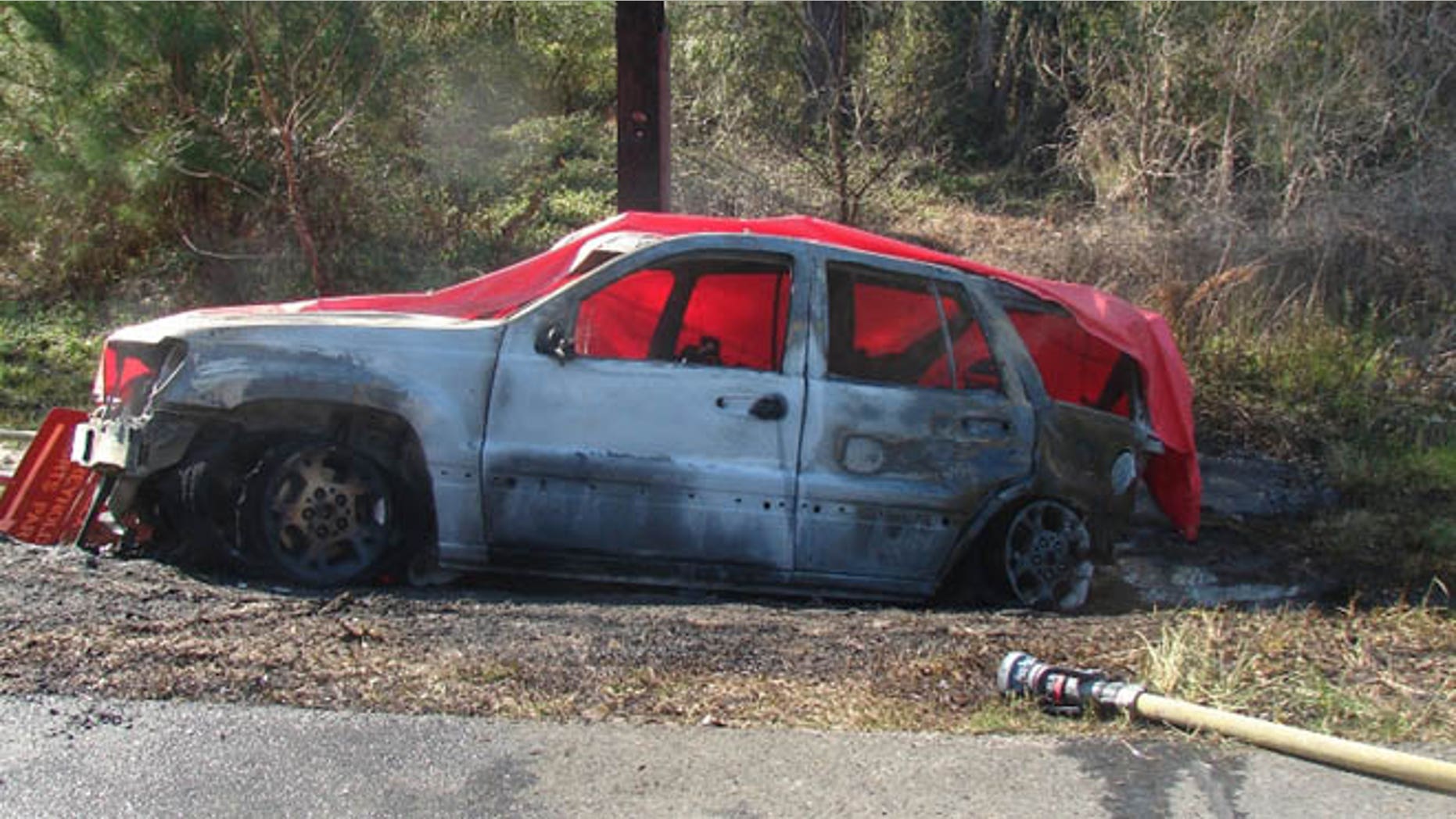 This March 6, 2012 photo provided by the law offices of Butler, Wooten & Fryhofer, LLP shows the scene of a crash in Bainbridge, Ga., where a 4-year-old boy named Remi Walden was burned and died when a Jeep Grand Cherokee was struck from the rear by a Dodge Dakota pickup truck. Chrysler is expected to file papers Tuesday, June 18, 2013, explaining why its refusing to recall 2.7 million older Jeep SUVs. (AP Photo/Courtesy of Butler, Wooten & Fryhofer, LLP)