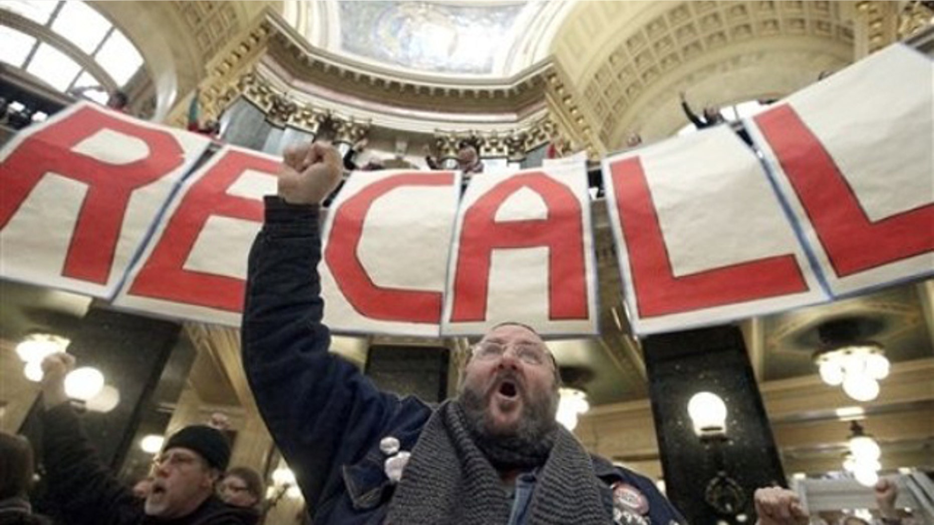FILE: Jan. 17, 2012: Protesters including labor union supporters at a rally at the Wisconsin State Capitol in Madison, Wisc.