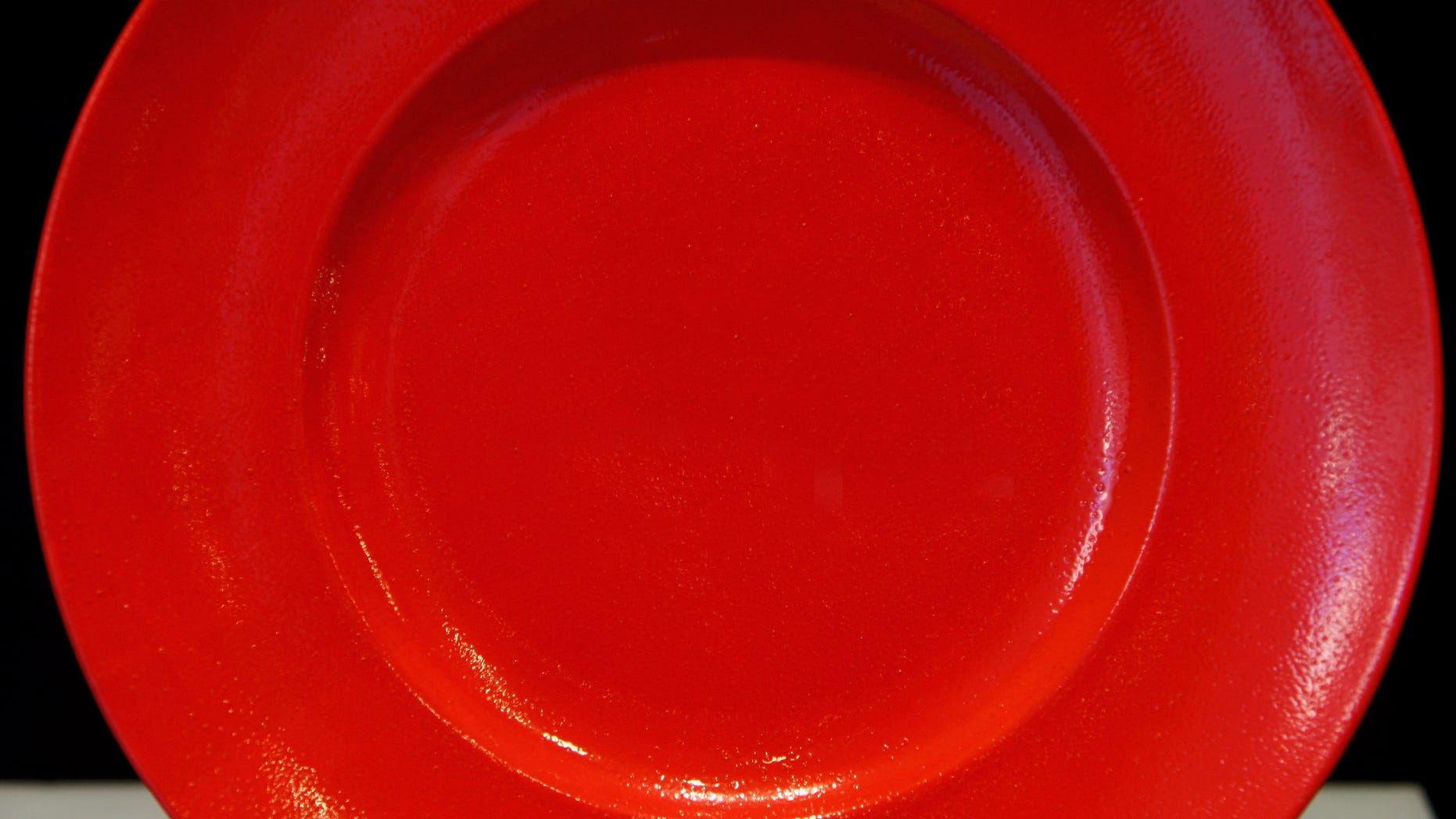 MUNICH, GERMANY - JANUARY 12: A red plate with the writing "Sale" is displayed in a Rosenthal store on January 12, 2009 in Munich, Germany. The traditional German porcelain manufactory has become insolvent and searches for an investor. (Photo by Miguel Villagran/Getty Images)