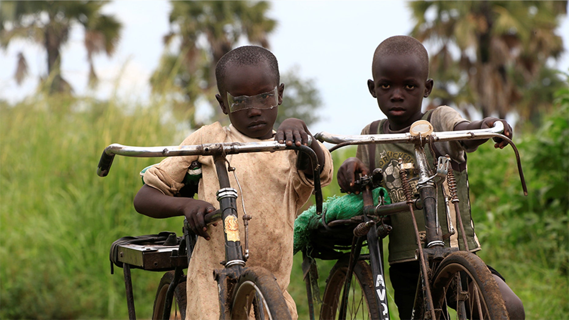 Refugee children from South Sudan ride their bicycles at Palorinya settlement in Moyo district northern Uganda October 25, 2017