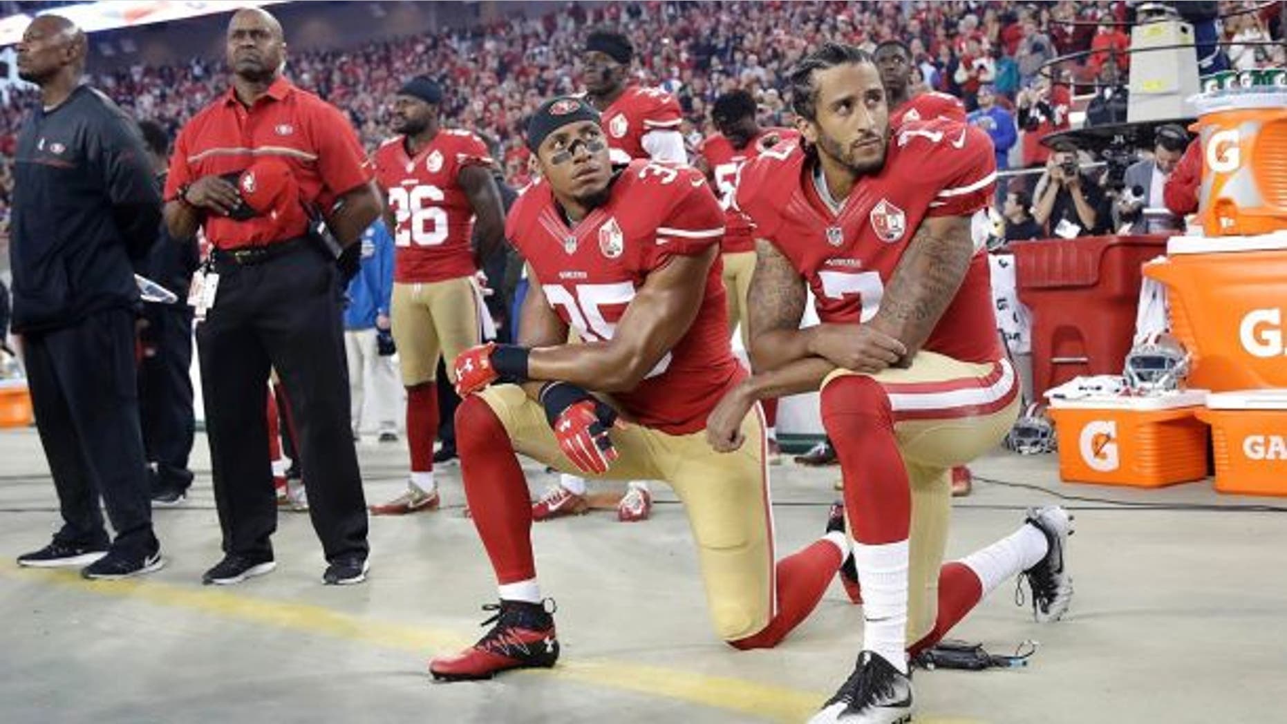 Eric Reid, left, kneels before the national anthem alongside Colin Kaepernick in 2016.