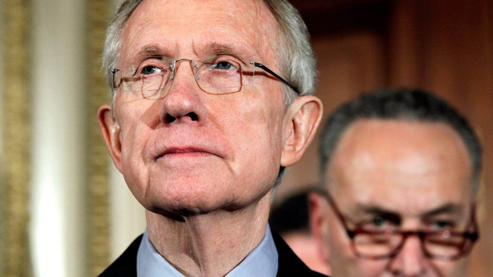 Senate Majority Leader Harry Reid of Nev., left, pauses during a news conference on Capitol Hill in Washington, Friday, April 8, 2011. (AP)