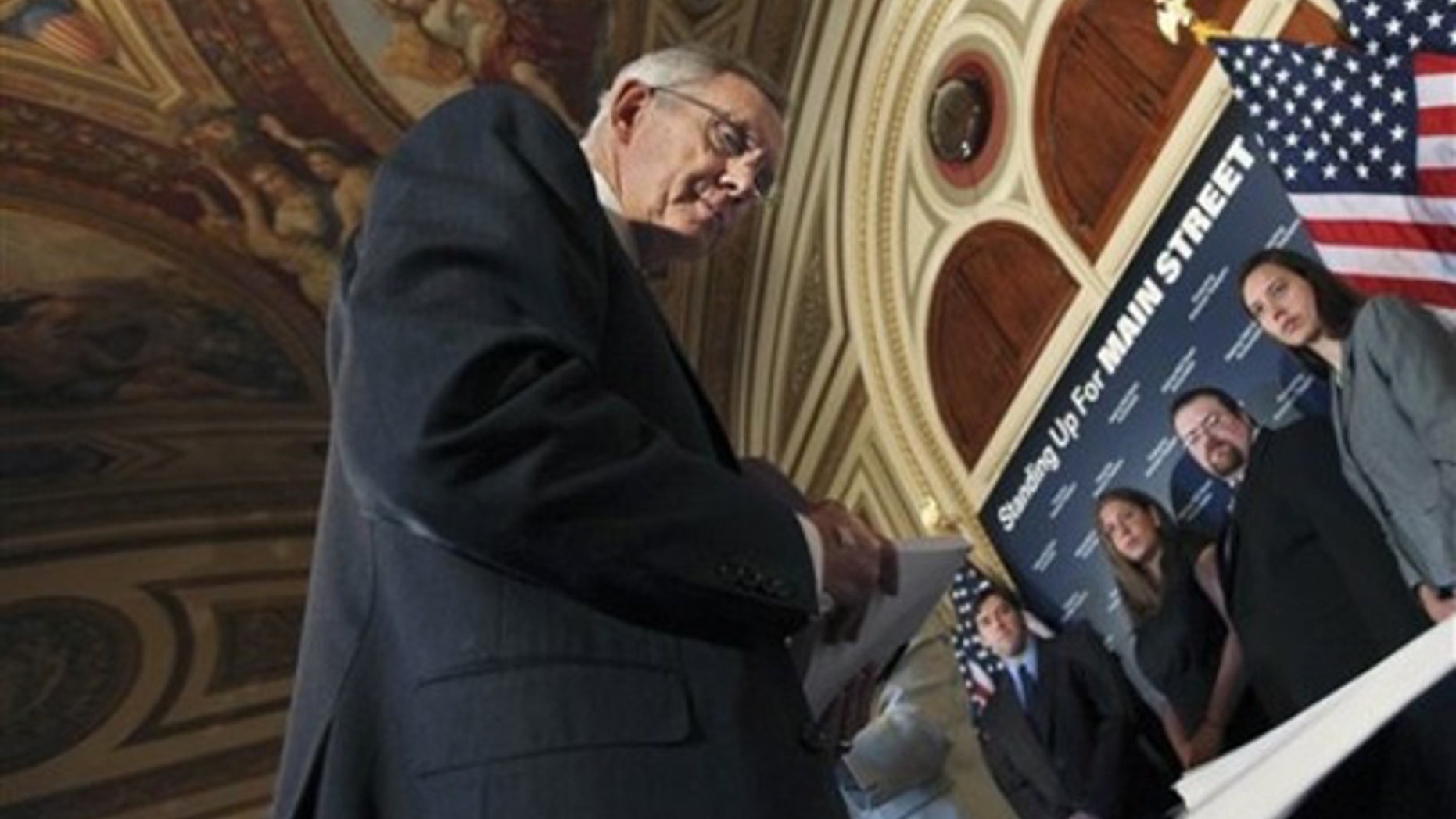 Senate Majority Leader Harry Reid of Nev. , looks at signed petition papers on a table in support of a strong financial reform, during a news conference discussing Wall Street accountability legislation, Wednesday, May 5, 2010, on Capitol Hill. (AP)