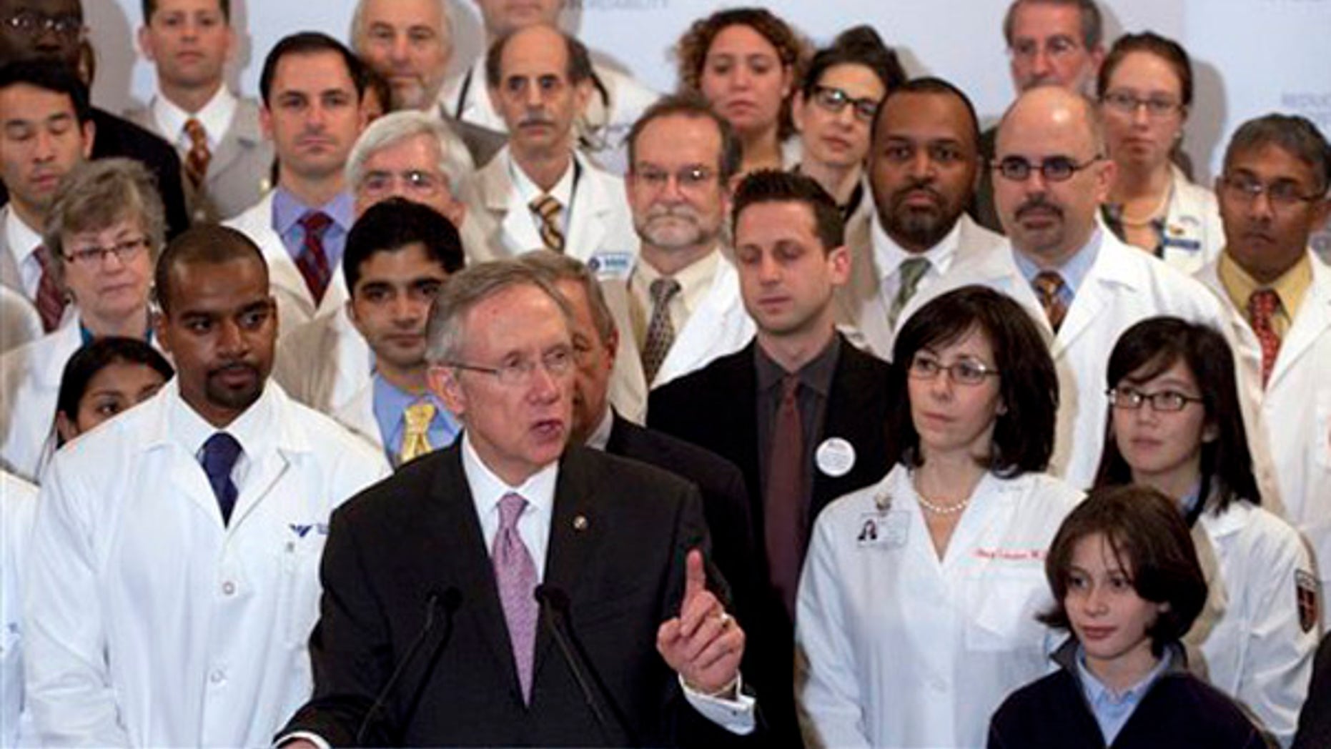 Senate Majority Leader Harry Reid, D-Nev., surrounded with doctors, speaks at a health care news conference on Capitol Hill in Washington, Thursday, Dec. 10, 2009. (AP)