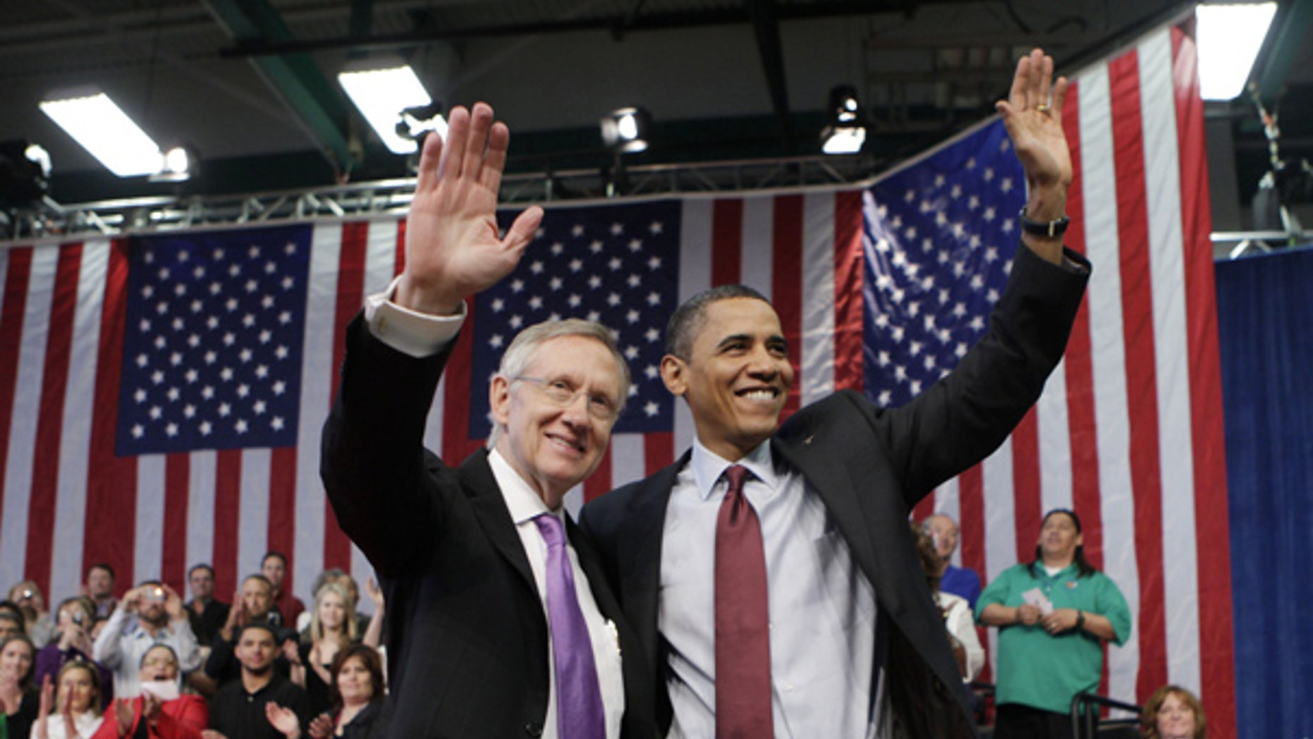 Feb. 19: President Obama and Senate Majority Leader Harry Reid wave following a town hall meeting in Henderson, Nev. (AP)