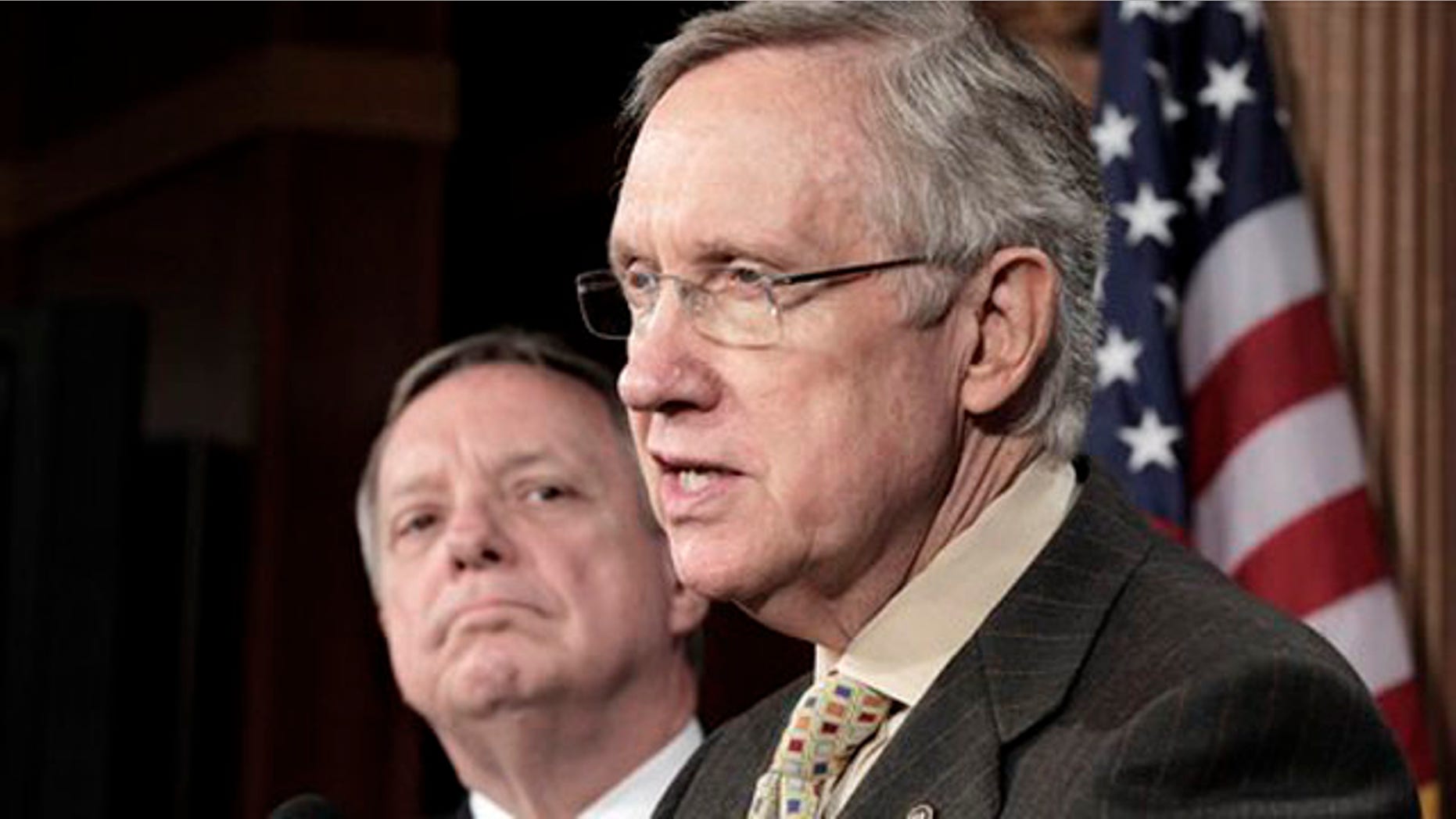 Senate Majority Leader Harry Reid, right, accompanied by Senate Majority Whip Richard Durbin, speaks to reporters on Capitol Hill June 30.