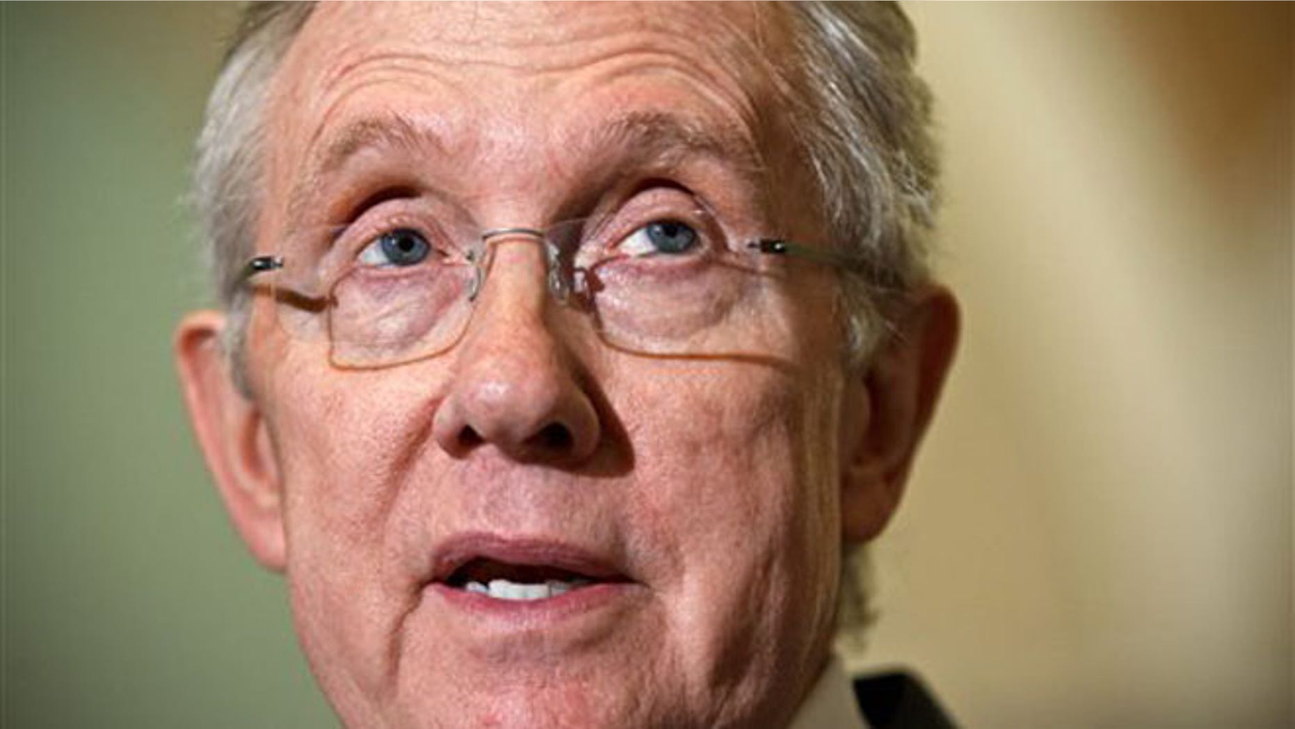 FILE: Senate Majority Leader Harry Reid speaks to reporters on Capitol Hill in Washington.