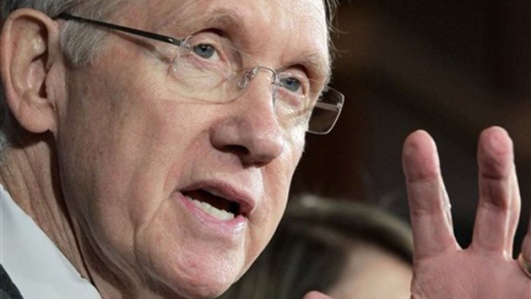 Senate Majority Leader Harry Reid gestures during a news conference on Capitol Hill Sept. 23 to discuss his fight with Republican lawmakers over whether funding for victims of natural disasters should be paid for by cuts to other government programs.