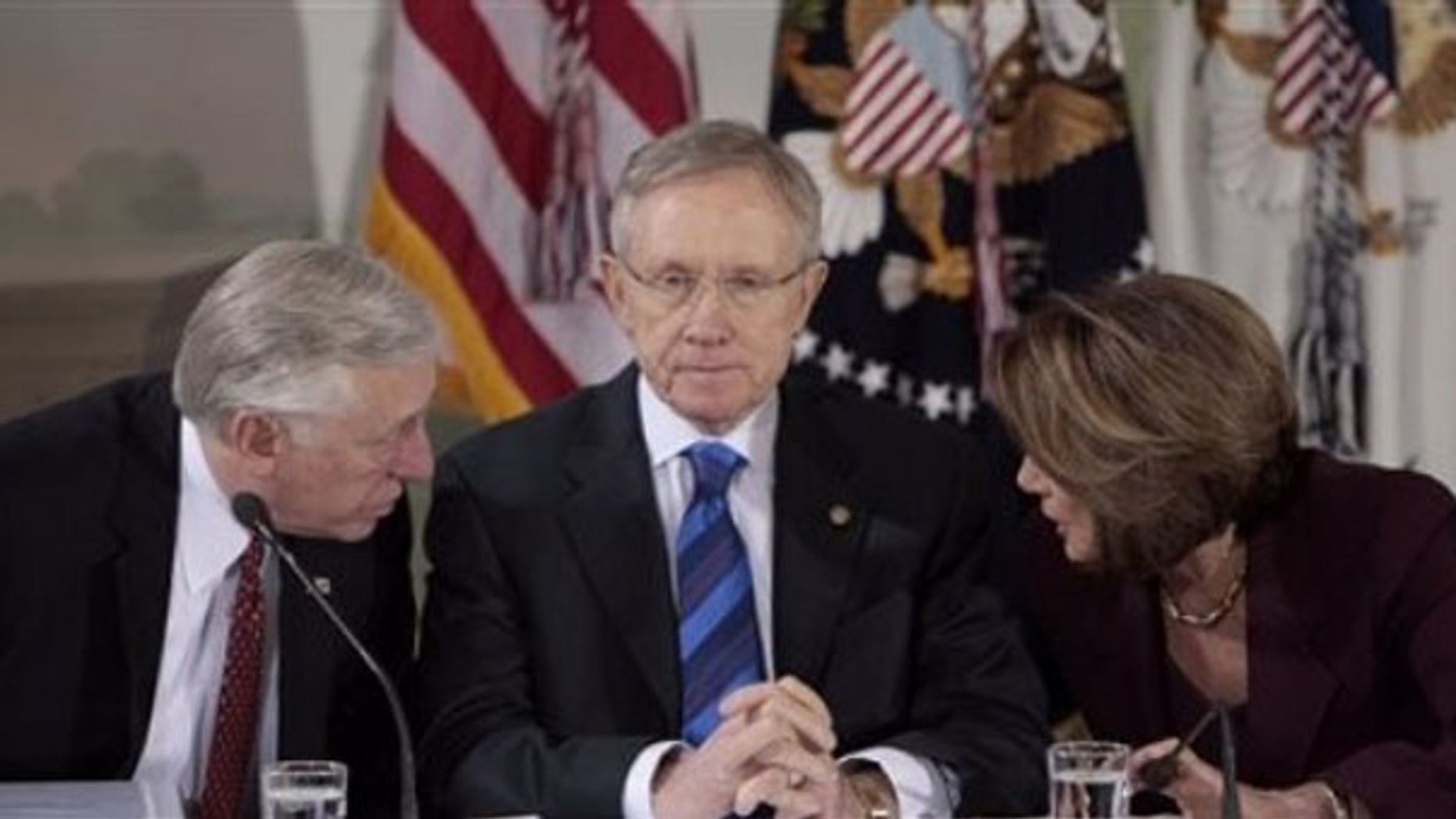 Senate Majority Leader Harry Reid, center, listens as House Majority Leader Steny Hoyer, left, talks to House Speaker Nancy Pelosi at a health care reform meeting Feb. 25 in Washington. (AP Photo)