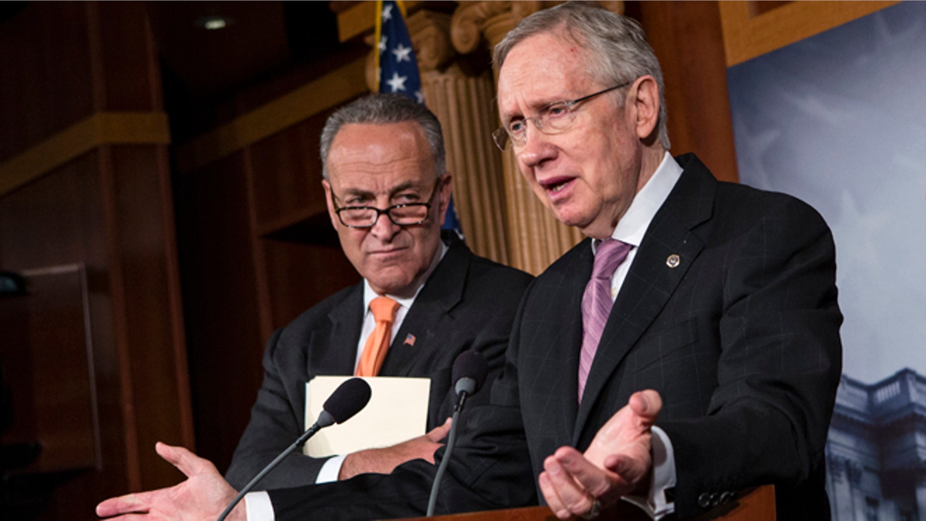 Oct. 2, 2013: Senate Majority Leader Harry Reid of Nev., right, accompanied by Sen. Charles Schumer, D-N.Y., speaks on Capitol Hill.
