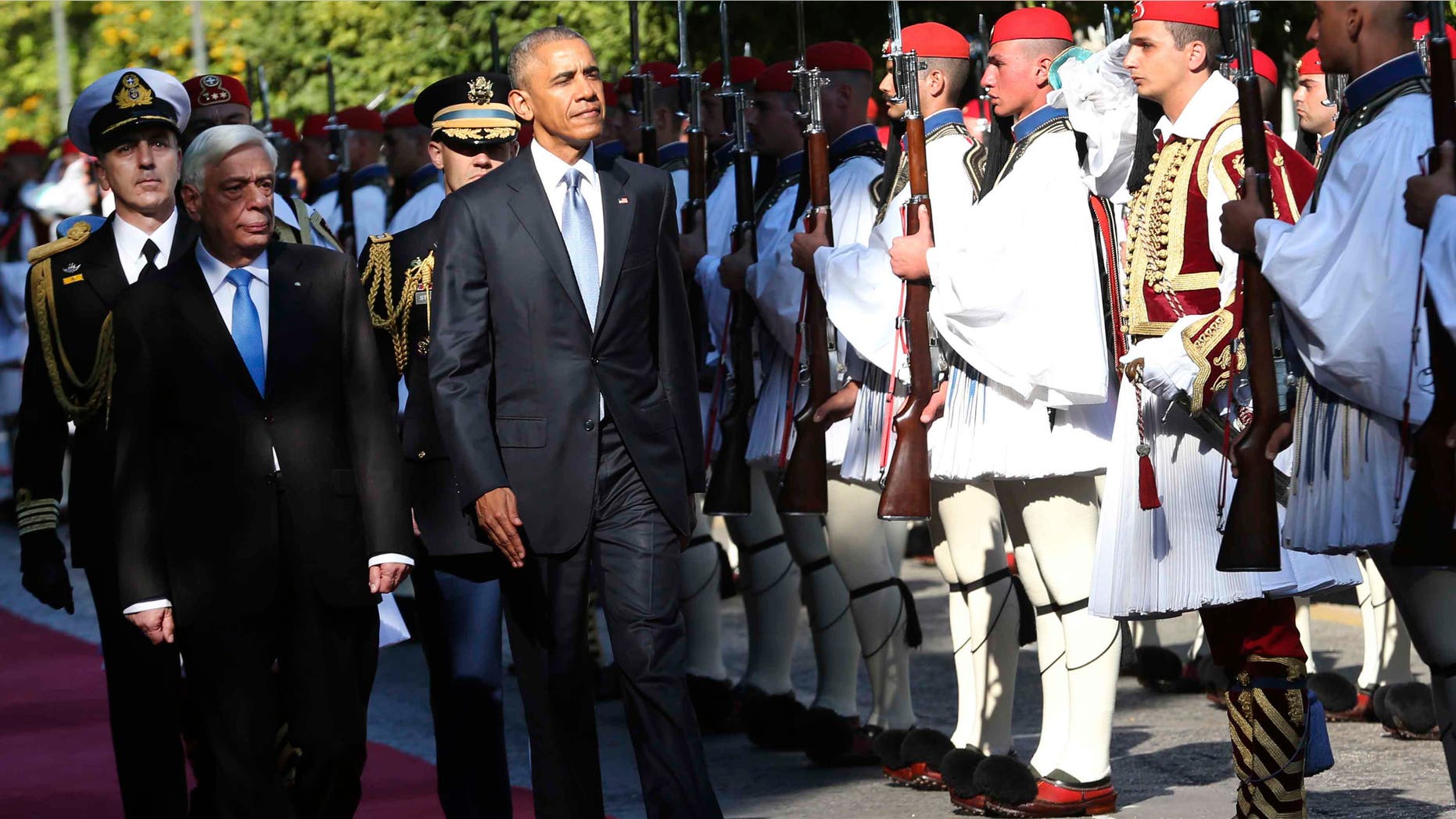 US President Barack Obama and his greek counterpart Prokopis Pavlopoulos review the Presidential Guard in Athens, Tuesday, Nov. 15, 2016. President Barack Obama arrived in Greece Monday morning on the first stop of his final foreign tour as president, the first visit to Greece by a sitting U.S. president since Bill Clinton in 1999 trip. (AP Photo/Lefteris Pitarakis)
