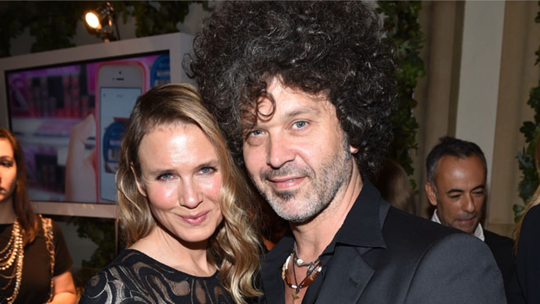 Renee Zellweger, left, and Doyle Bramhall II attend ELLE's 21st annual Women In Hollywood Awards at the Four Seasons Hotel on Monday, Oct. 20, 2014, in Los Angeles. (Photo by John Shearer/Invision/AP)
