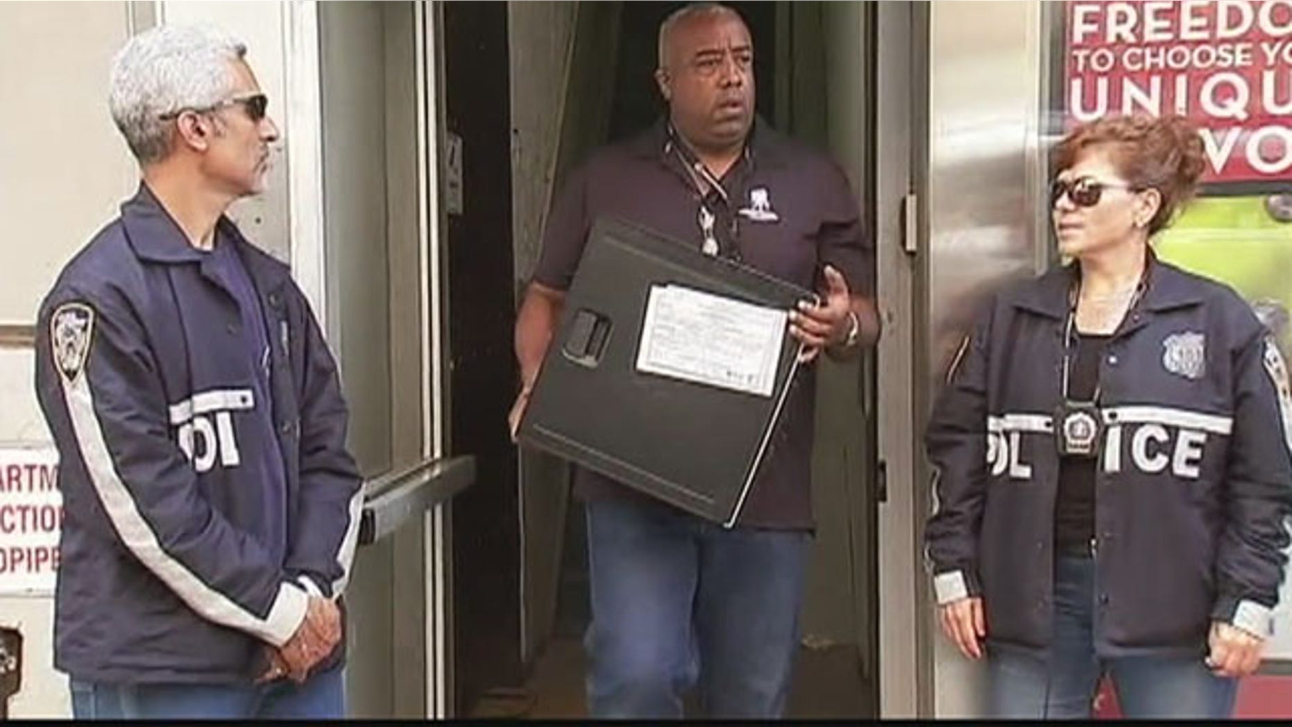 Aug. 25, 2015: Investigators remove computer equipment from the offices of Rentboy.com in New York City. (WNYW)